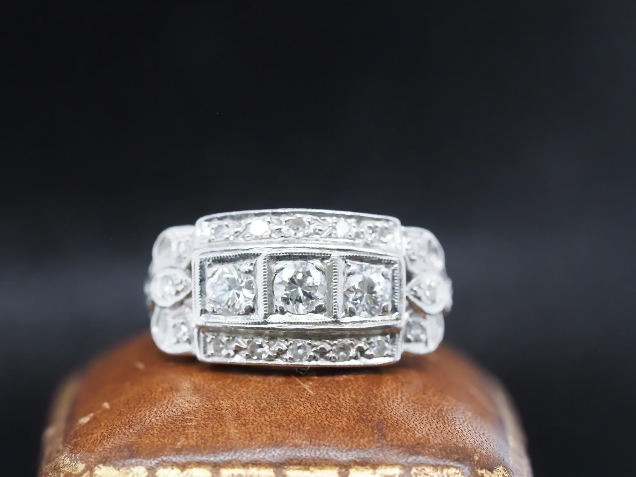 Year: 1930s
Item Details:
Ring Size: 6.75 (Sizable)
Metal Type: Platinum [Hallmarked, and Tested]
Weight: 5.7 grams
Diamond Details: .80ct total weight, G Color, VS Clarity, Old European Brilliant Cut Diamonds.
Band Width: 1.8
Condition: Excellent