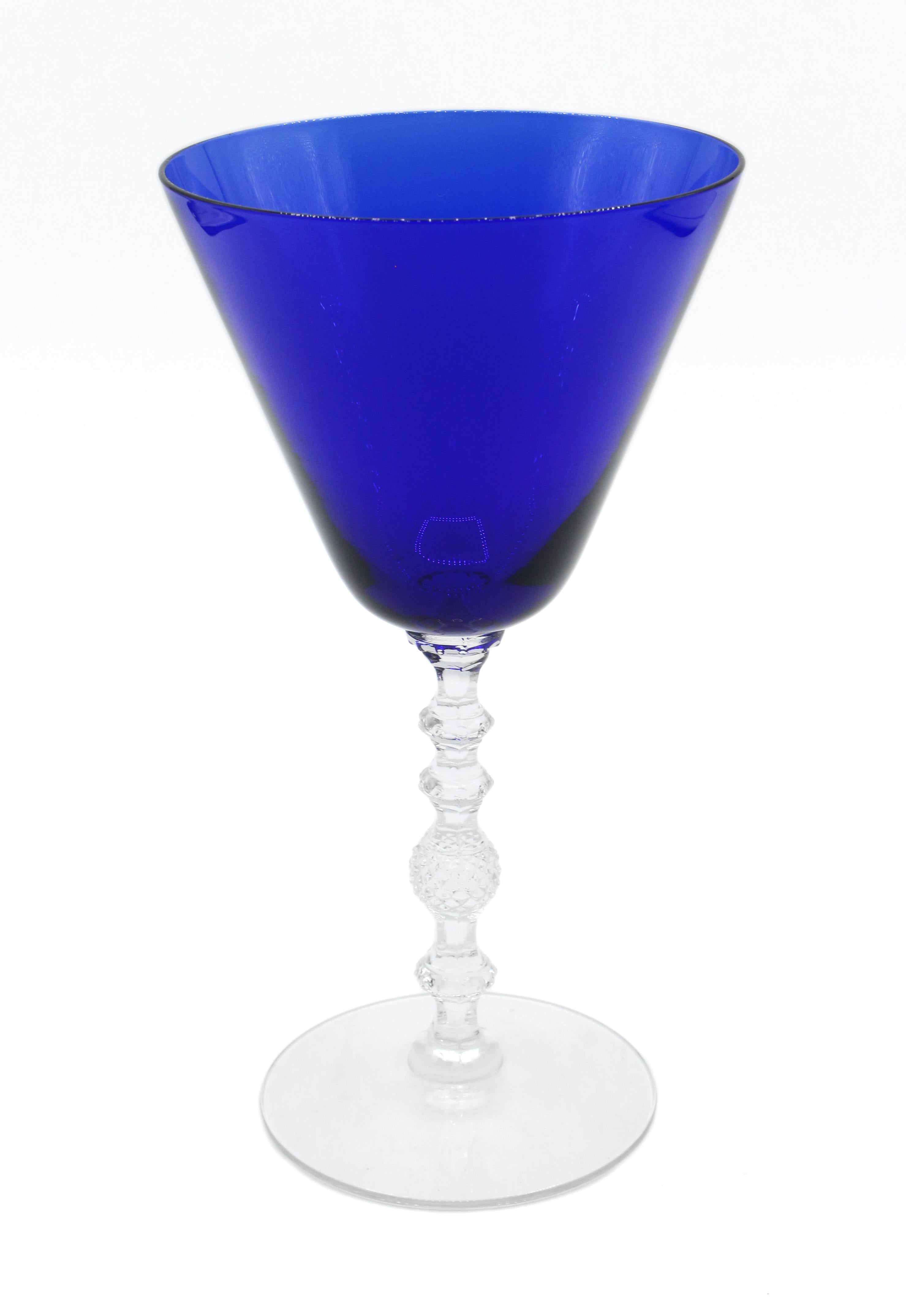A set of 10 water or large wine goblets by Cambridge Glass Co., Ohio, c.1930s. Cobalt Blue bowls with faceted, molded clear glass stems & bases. Pattern 3122, rarely found. 
7