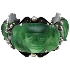 Circa 1930s Sterling Silver and Carved Green Onyx Mask Bracelet