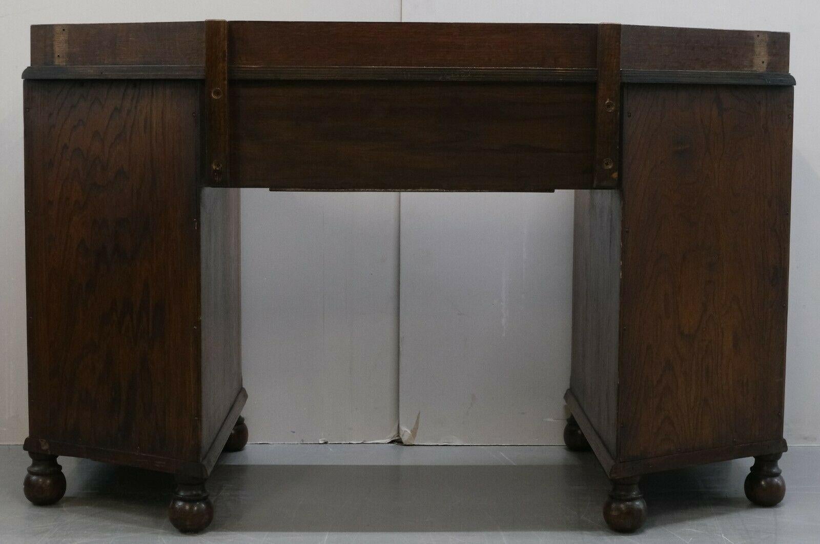 Circa 1930's Waring & Gillow Ltd Lancaster Oak Desk on Bun Legs & Seven Drawers For Sale 5