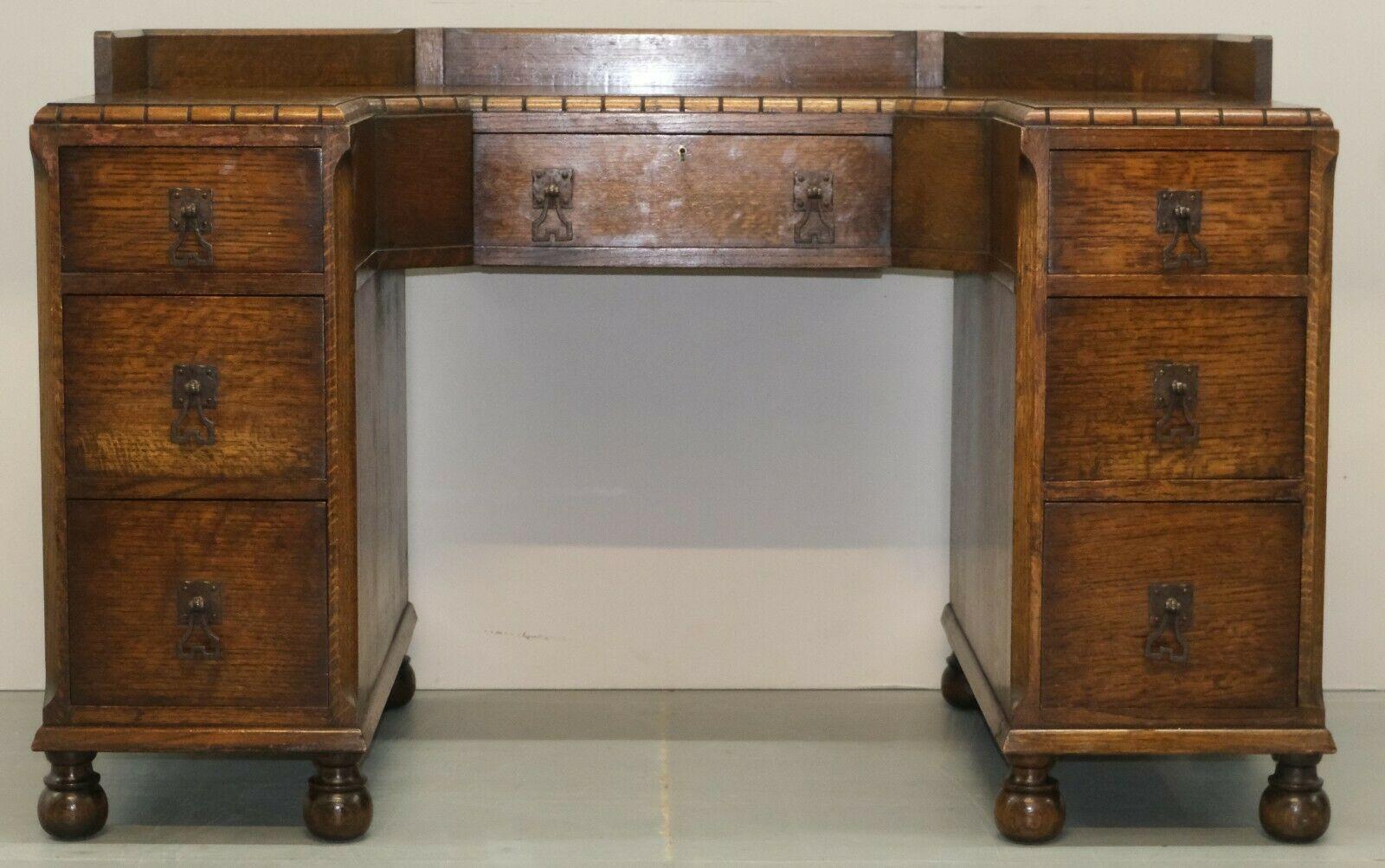 We are delighted to offer for sale this beautiful Waring & Gillow circa 1930's oak desk, dressing table on bun feet.

Made by one of the greatest furniture makers in British History; This was originally made as a vanity/dressing table but with the