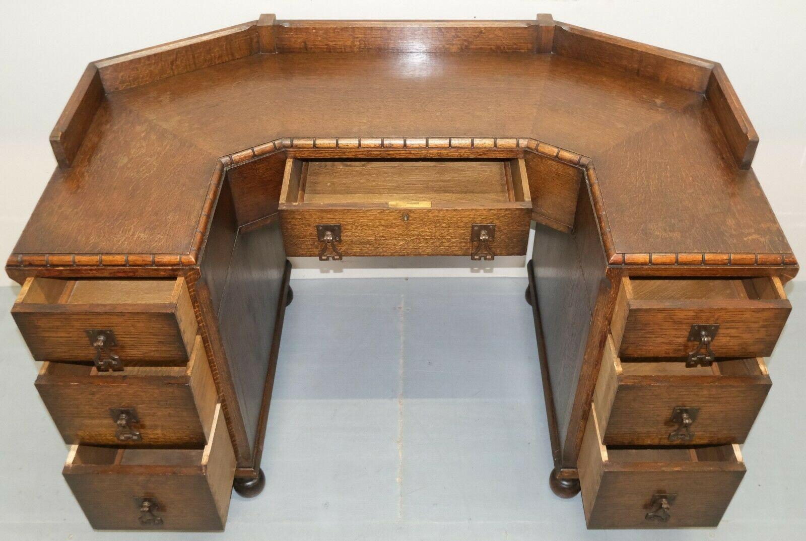 Hand-Crafted Circa 1930's Waring & Gillow Ltd Lancaster Oak Desk on Bun Legs & Seven Drawers For Sale