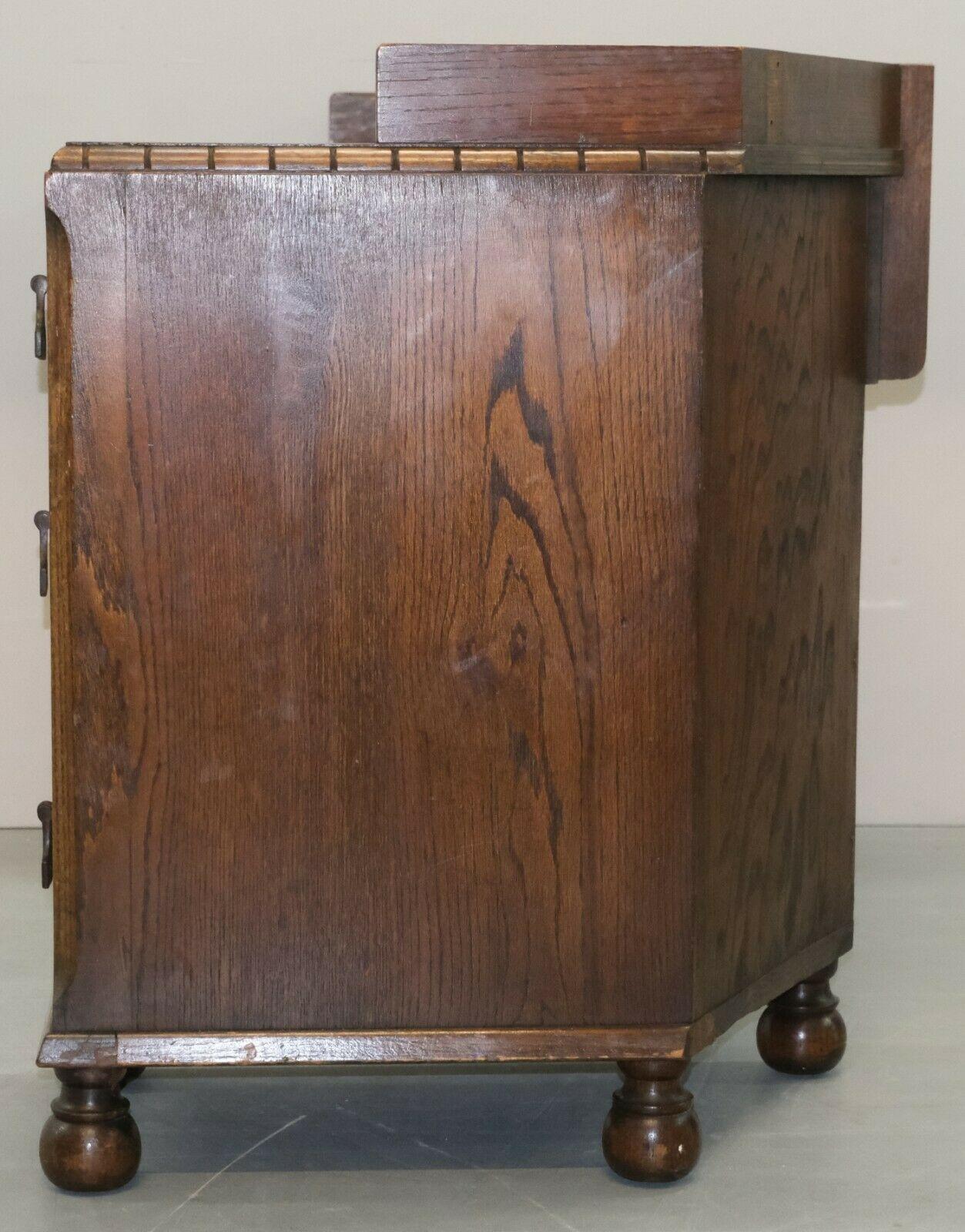 Circa 1930's Waring & Gillow Ltd Lancaster Oak Desk on Bun Legs & Seven Drawers For Sale 2