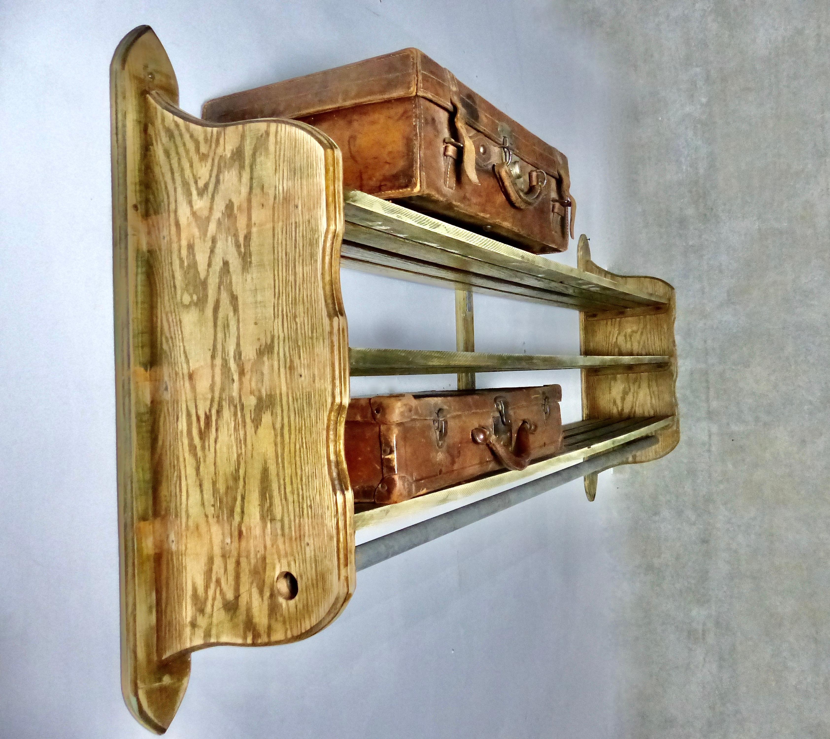 A large, wall-mounted hat-and-coat rack (or luggage rack) from circa 1930. Huge amount of storage space on three shelves. Its sturdy, solid wood construction can handle anything your mudroom throws at it.
Dimensions: 38” H x 78” W x 13” D.