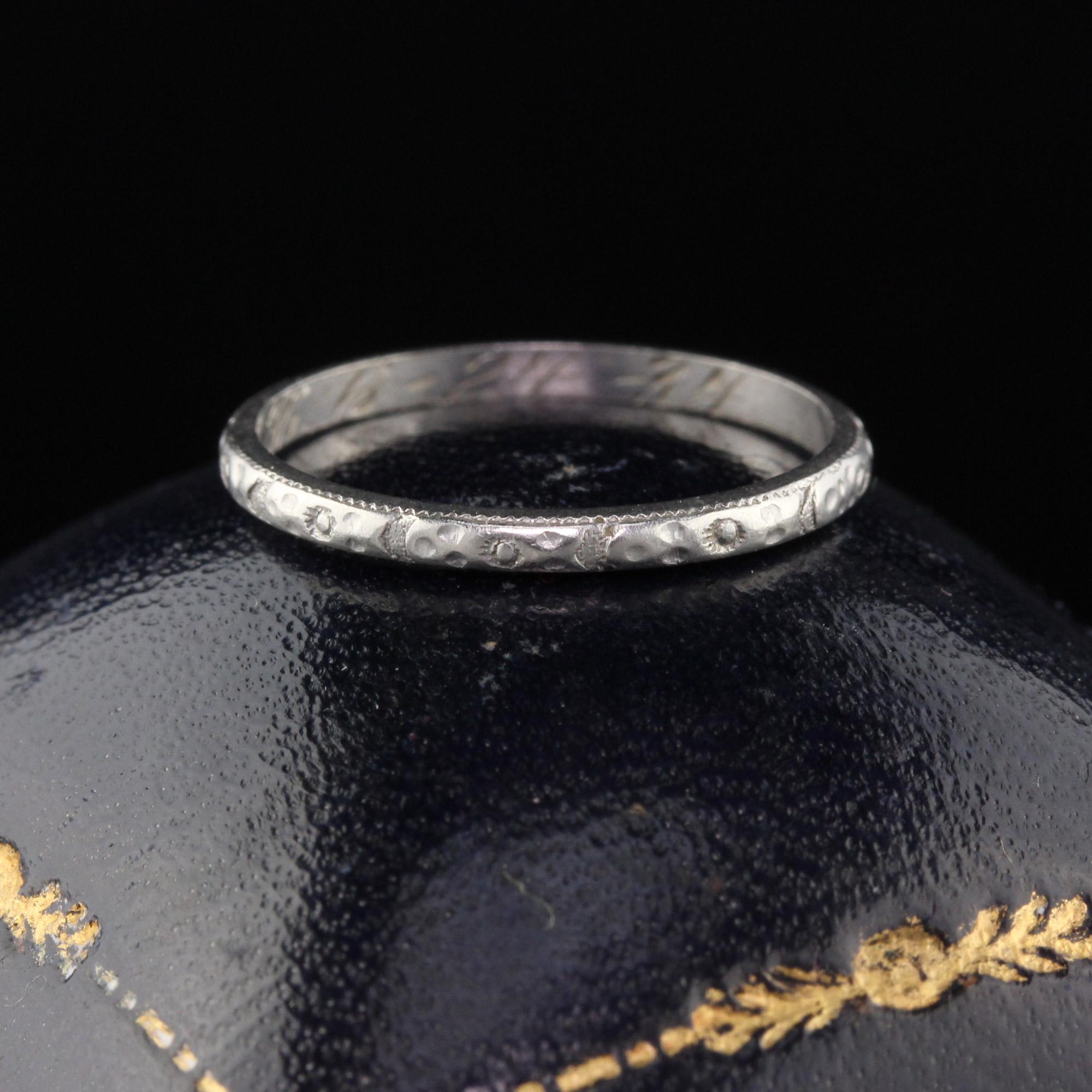 Gorgeous Art Deco wedding band with engravings going all the way around in very good condition. Thin and perfect for stacking!

#R0224

Metal: Platinum

Weight: 1.6 Grams

Ring Size: 5 1/4

*Unfortunately this ring cannot be sized

Measurements: 1.6