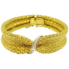Circa 1940 18 karat Gold Mesh and Diamond Set Bangle Bracelet