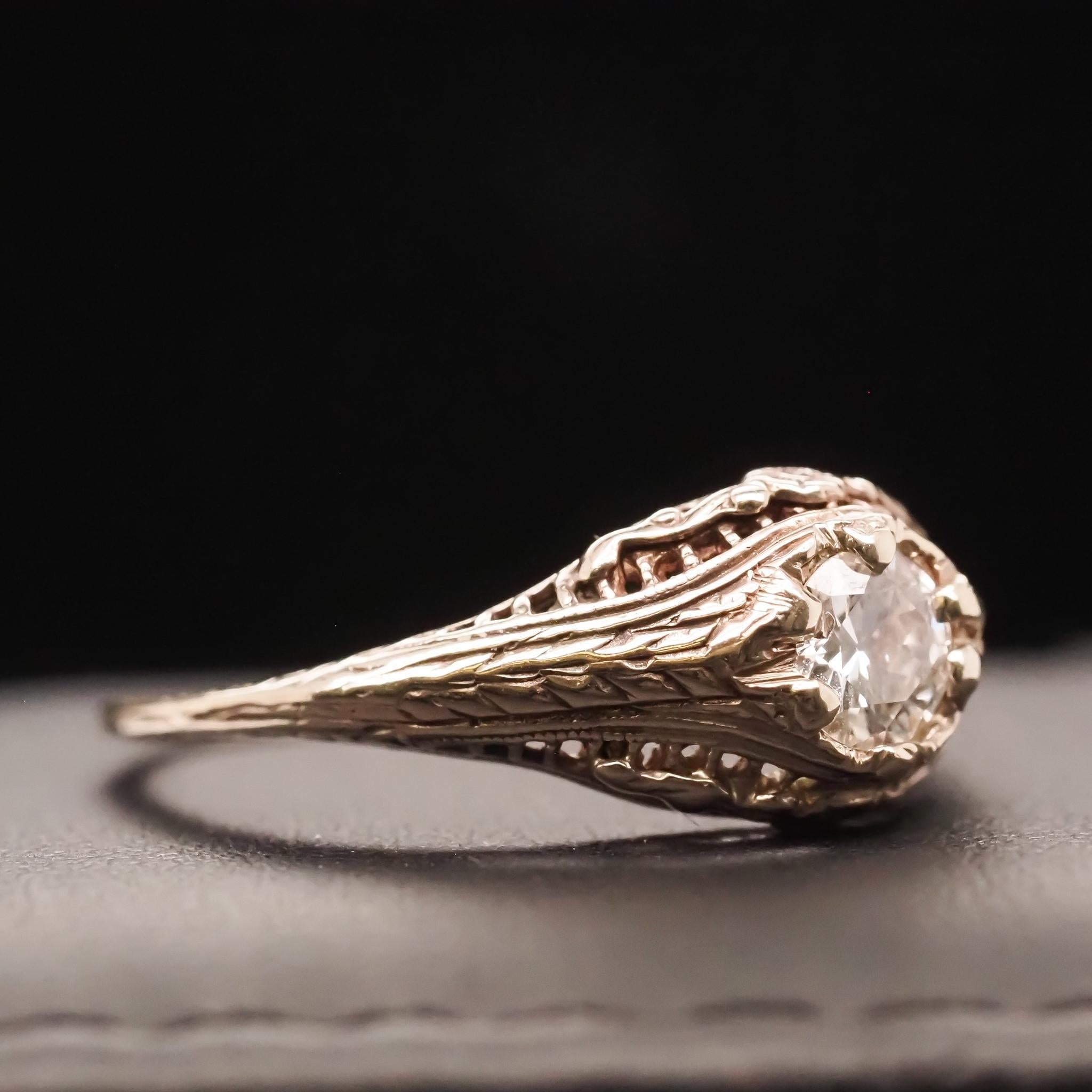 Year: 1940s
Item Details:
Ring Size: 7.75(Sizable)
Metal Type: [Hallmarked, and Tested]
Weight: 2.1grams
Diamond Details: .40ct, Old European Brilliant, H Color, VS Clarity
Band Width: 1.25mm
Condition: Excellent
Art Deco Era