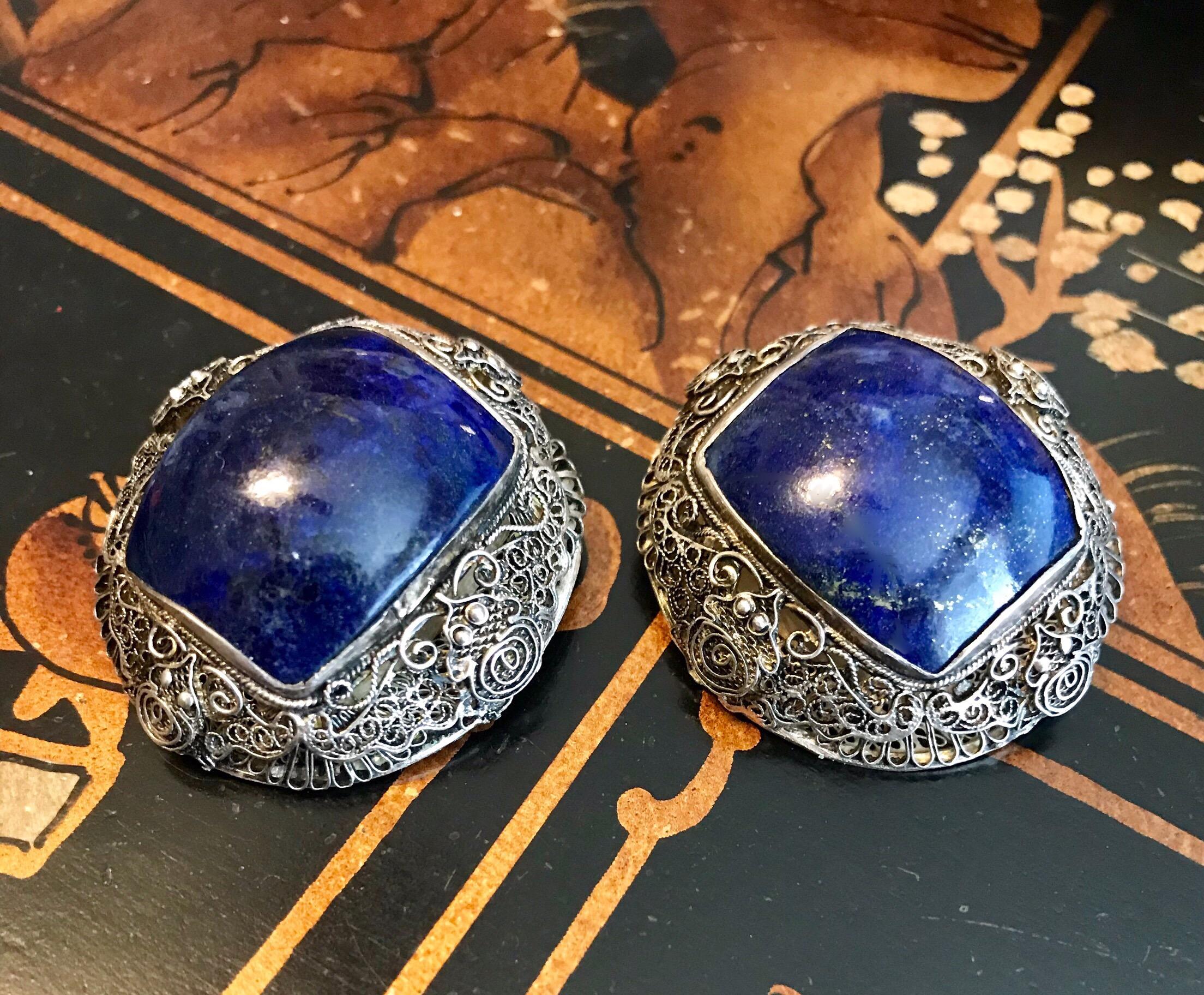 Circa 1940s Chinese Sterling Silver and Lapis Lazuli cabochon clip back earrings.   Beautifully handcrafted sterling filigree earrings with butterfly motifs on all four sides and bezel set with large, rectangular lapis cabochons.  Each earring