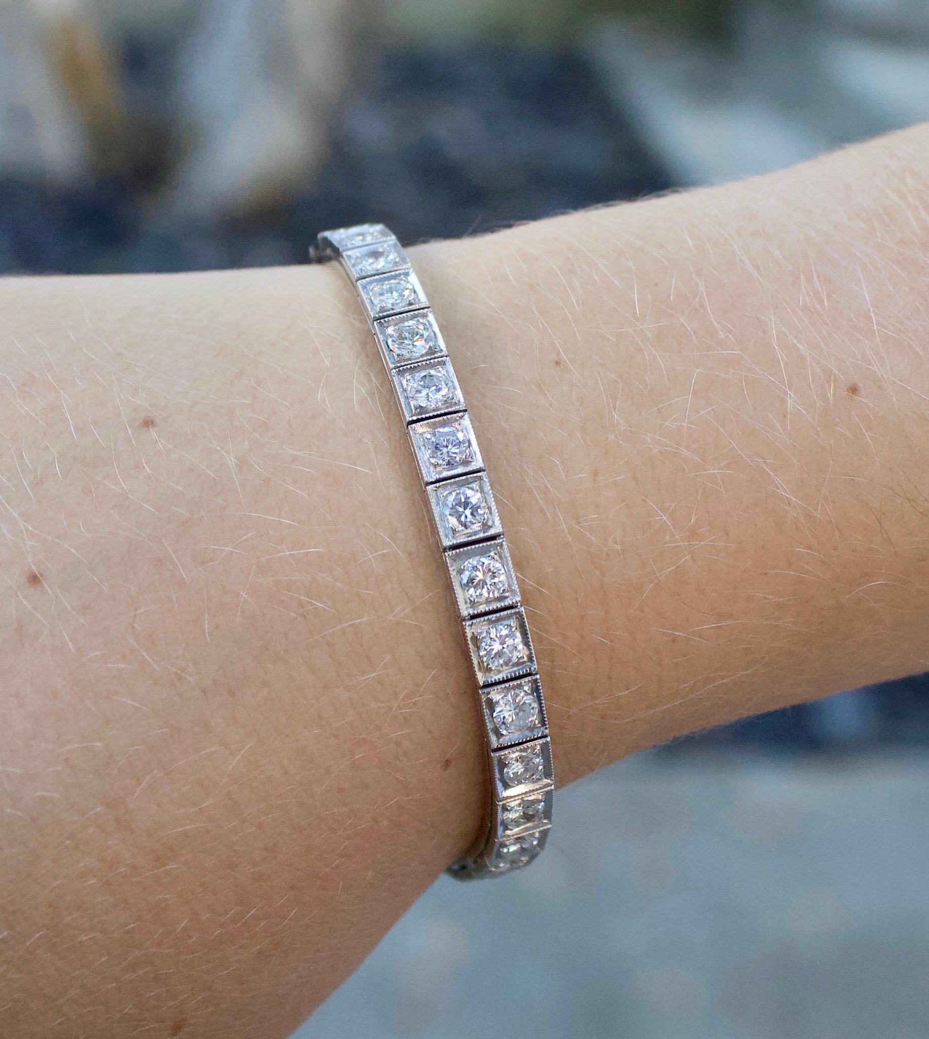 Circa 1940's Diamond Tennis Bracelet in White Gold 6.50 Carats
The Classic
Thirty Two Round Brilliant Cut Diamonds Weighing 6.50 Carats Approximately Average Size .20 Carats [GHI - VS2- SI1]
[bright with no imperfections visible to the naked eye] 
7