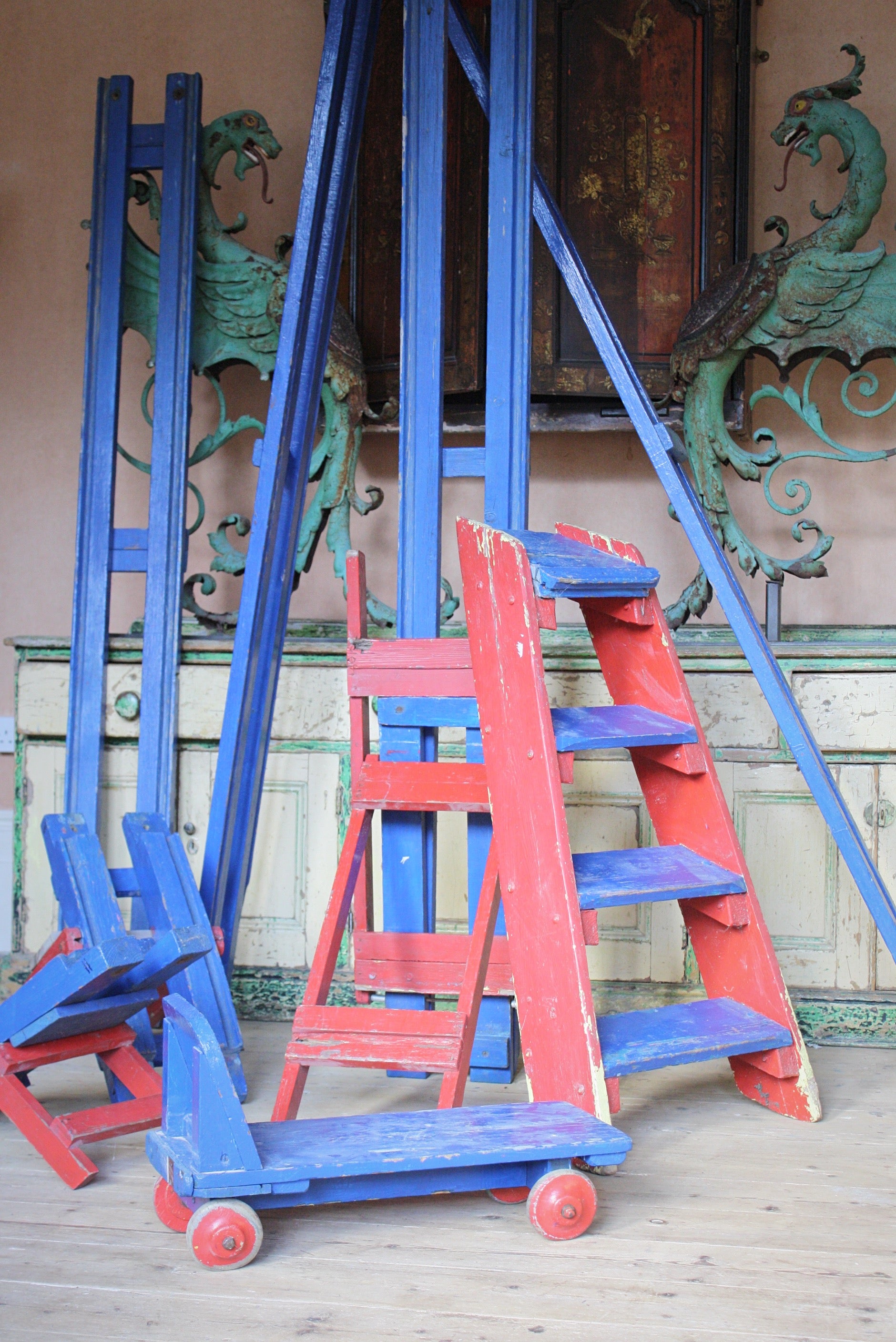 A wonderful period showman's mini rollercoaster, constructed in pine with its original steps and single ride on cart. Typical of the travelling fairground community, the coaster has been overpainted and overpainted, so plenty of character. But the