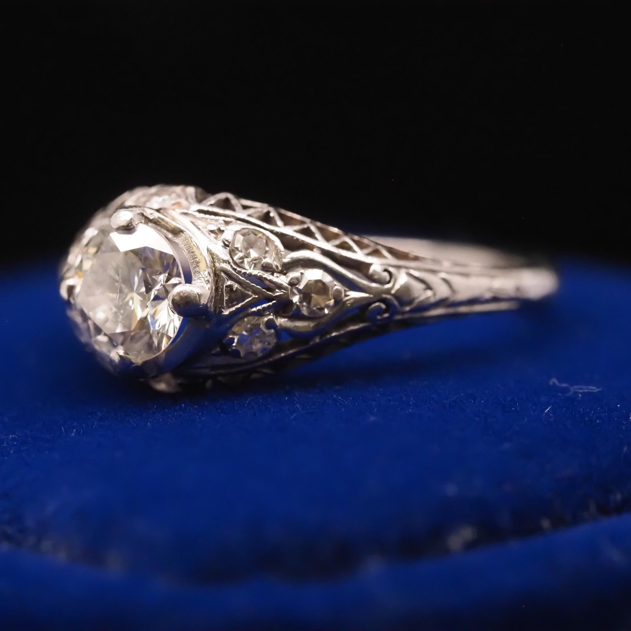 Circa 1940s Platinum Filigree .60ct Transitional Round Diamond Engagement Ring In Good Condition For Sale In Atlanta, GA