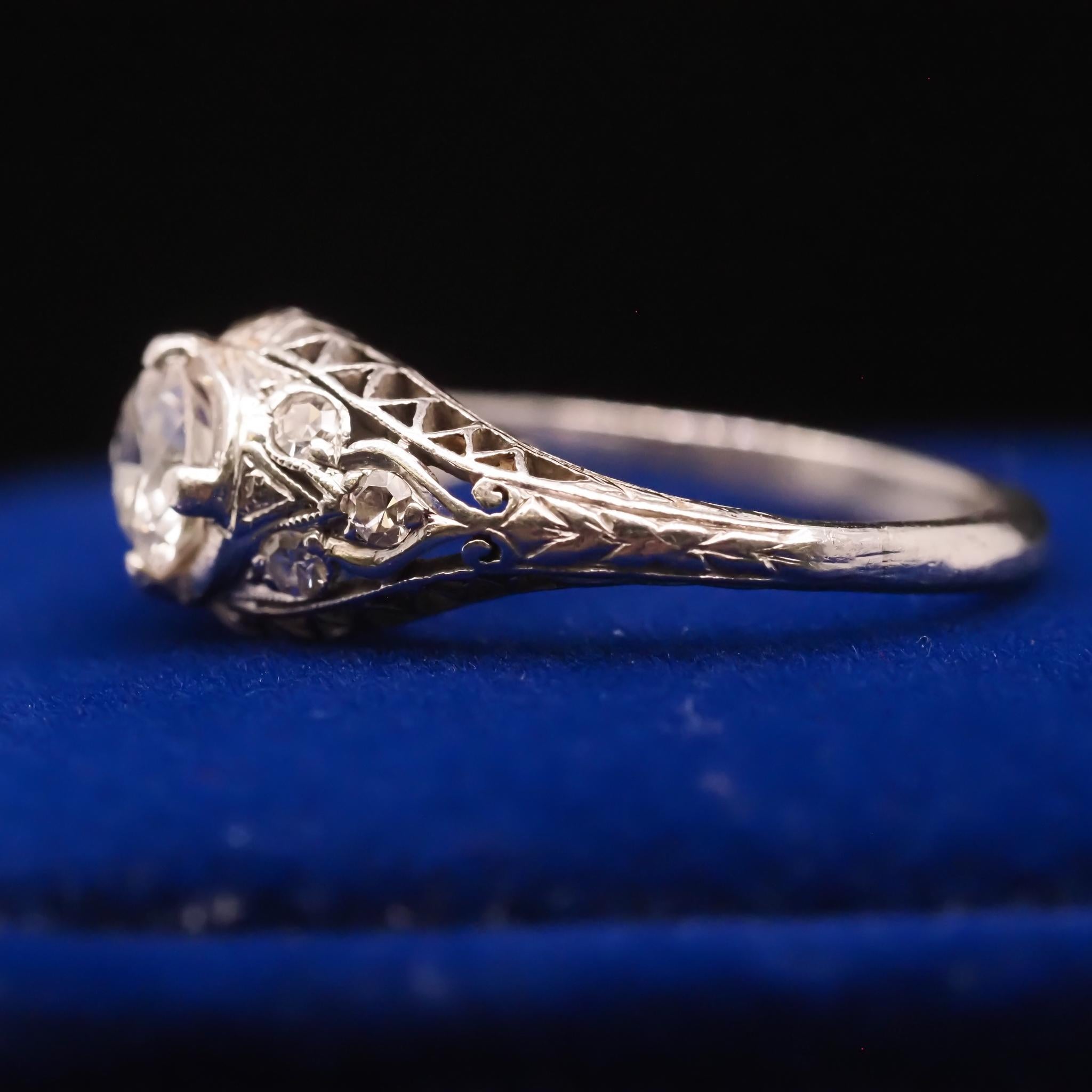 Women's Circa 1940s Platinum Filigree .60ct Transitional Round Diamond Engagement Ring For Sale