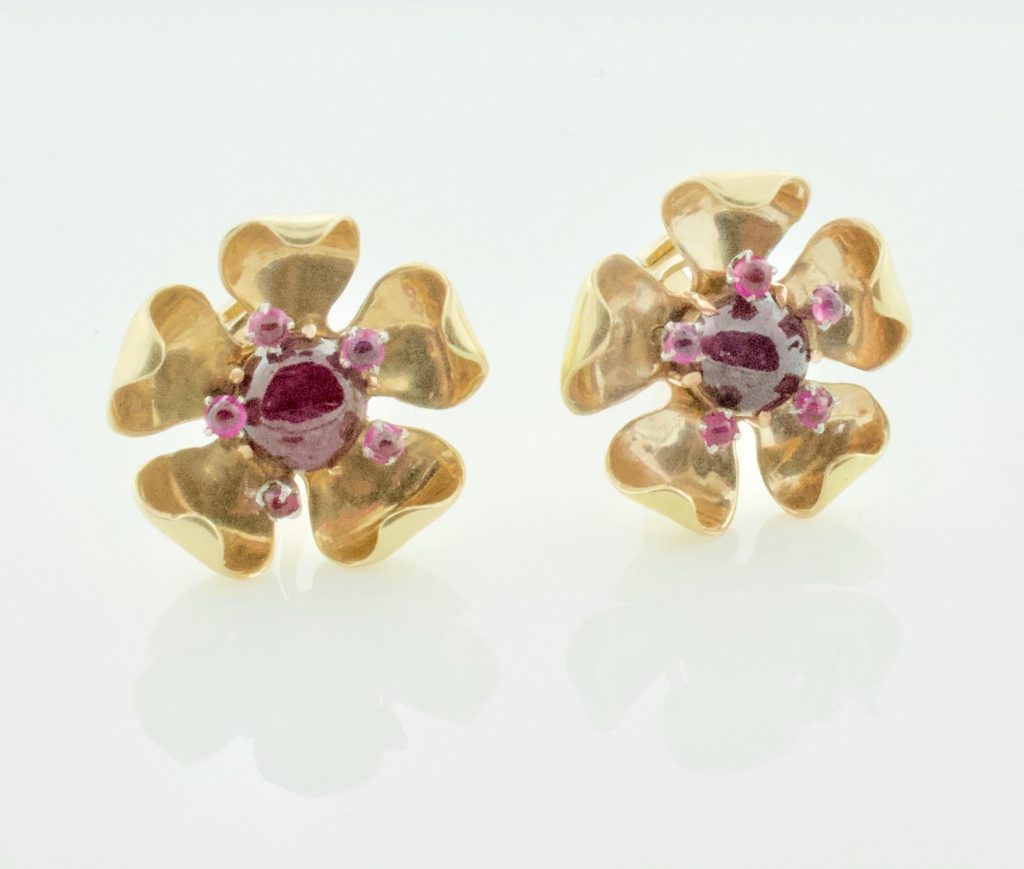Circa 1940's Ruby and Diamond Floral Earrings in Yellow Gold.  
Eleven Cabochon Rubies Weighing 2.00 Carats Approximately
Very Stylish and Wearable 
Clip On.  Posts can be added by us or a qualified jeweler