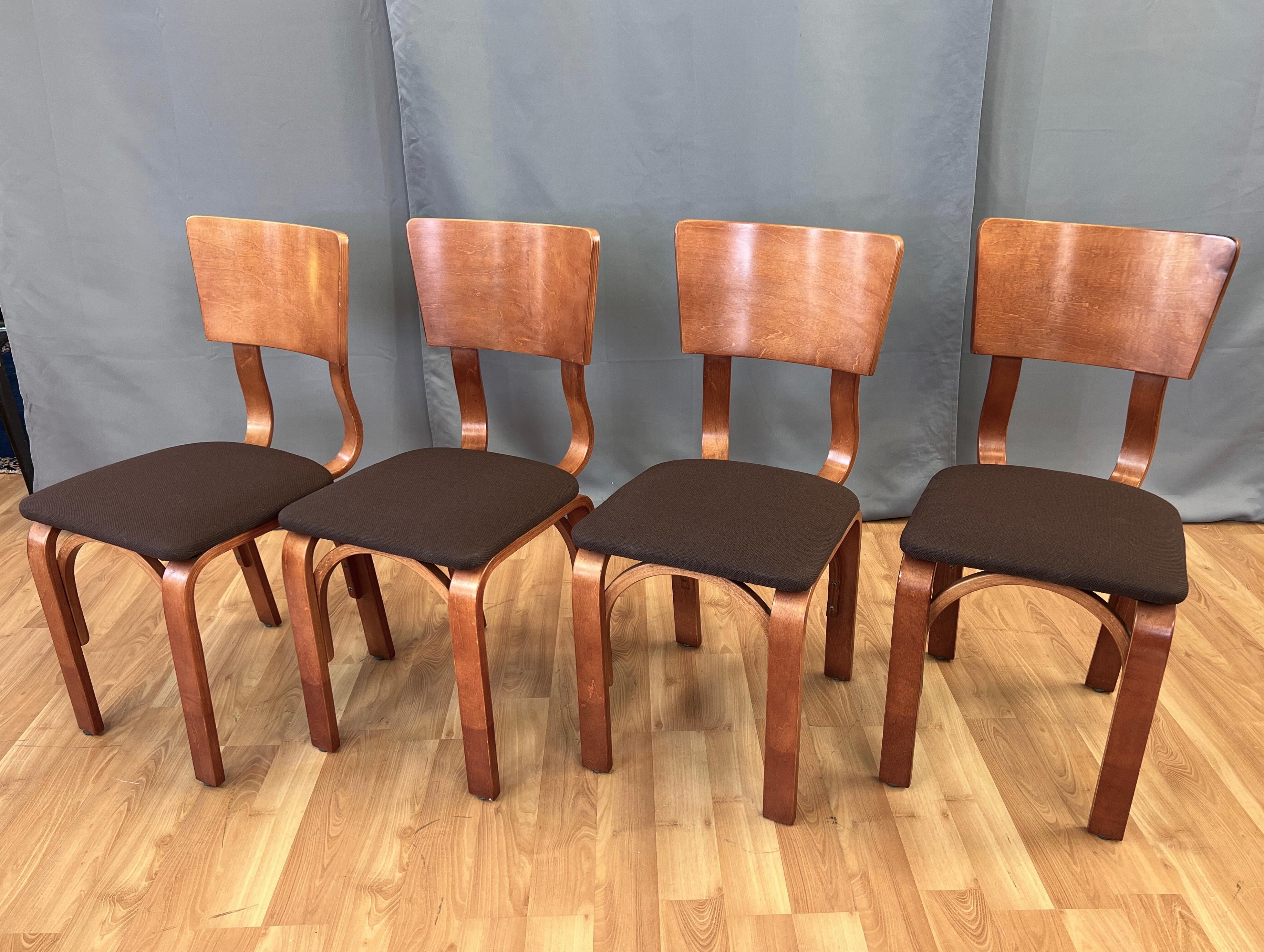 Offered here is a set of four Thonet bentwood dining chairs, circa 1940s.
Legs are two long pieces of wood in layers, that have been bent into U shapes, with the top holding the seating area.
Has two smaller versions of the legs acting as