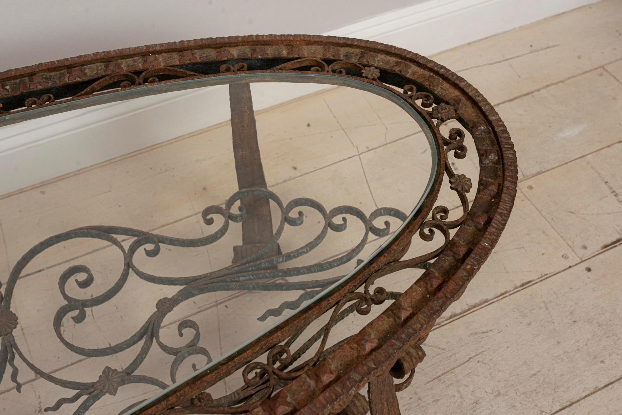 oval wrought iron coffee table with glass top