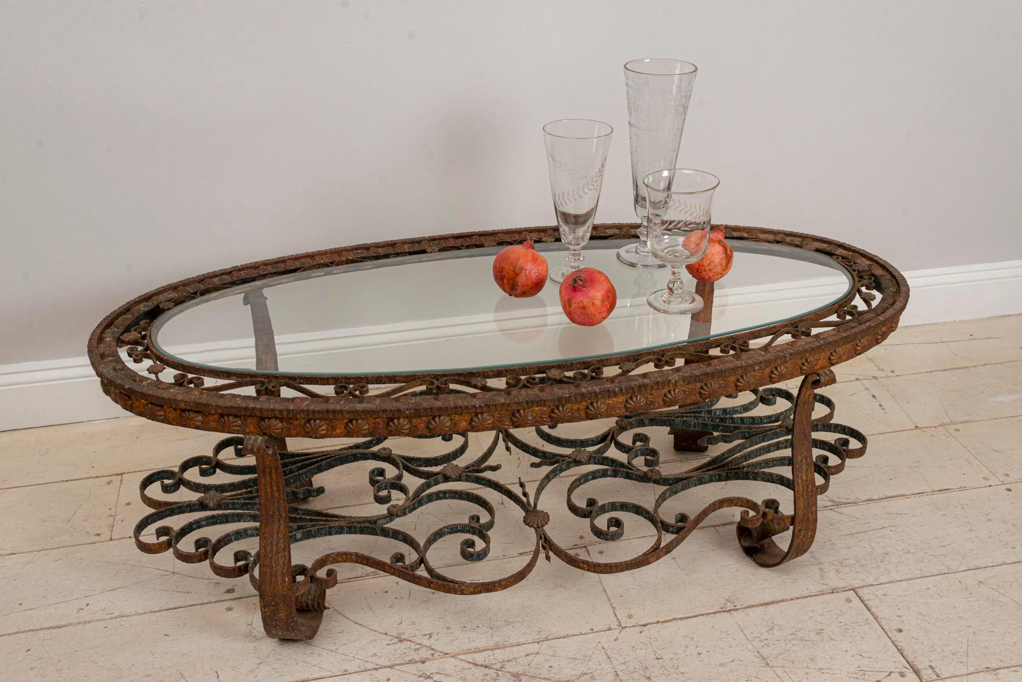 Mid-Century Modern Spanish Oval Decorative Wrought Iron and Glass Coffee Table, circa 1940s For Sale