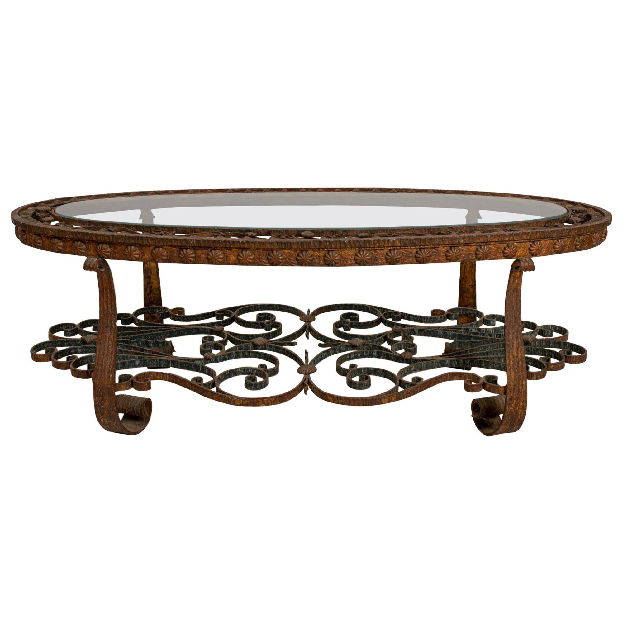 Spanish Oval Decorative Wrought Iron and Glass Coffee Table, circa 1940s