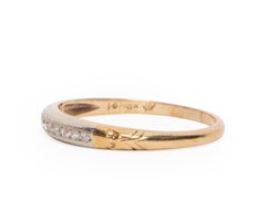 Vintage Art Deco 9 Diamond Channel 14 Karat Two-Tone Wedding Band, circa 1940s