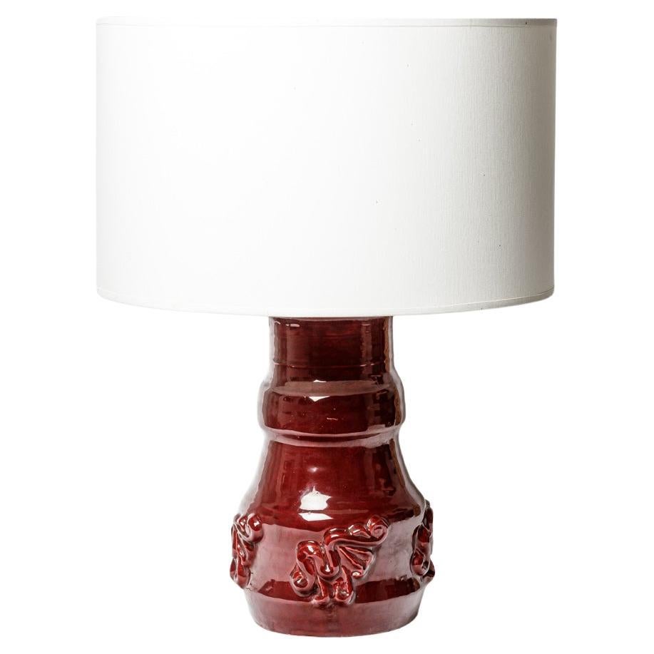 Circa 1950 large red ceramic table lamp by Jean Austruy 20th century design For Sale