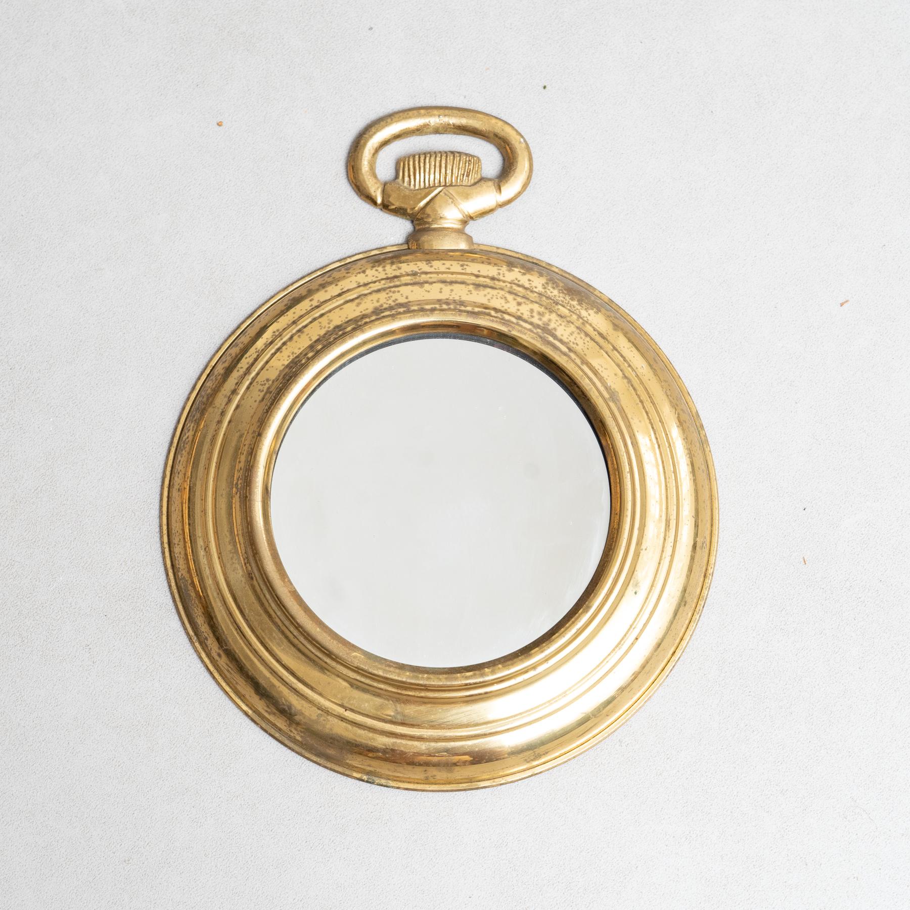 Metal Mirror, circa 1950.  Traditionally manufactured in Spain. By unknown designer.  Embrace the charm of Mid-Century design with this metal and wood circular mirror, traditionally manufactured in Spain by an unknown designer circa 1950. This