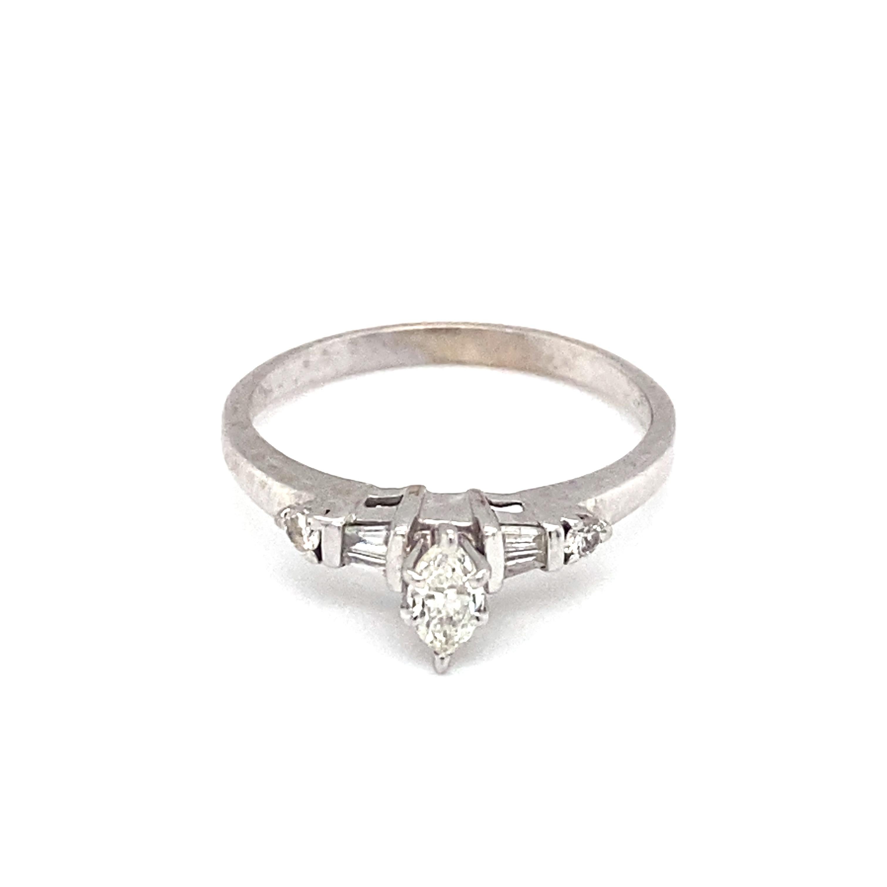 
Item Details: This marquise diamond engagement ring is a beautiful vintage piece that is perfect for a new bride!

Circa: 1950s
Metal Type: 14k white gold
Weight: 2.5g
Size: US 8.25, resizable

Diamond Details:

Carat: 0.25ct center
Shape: