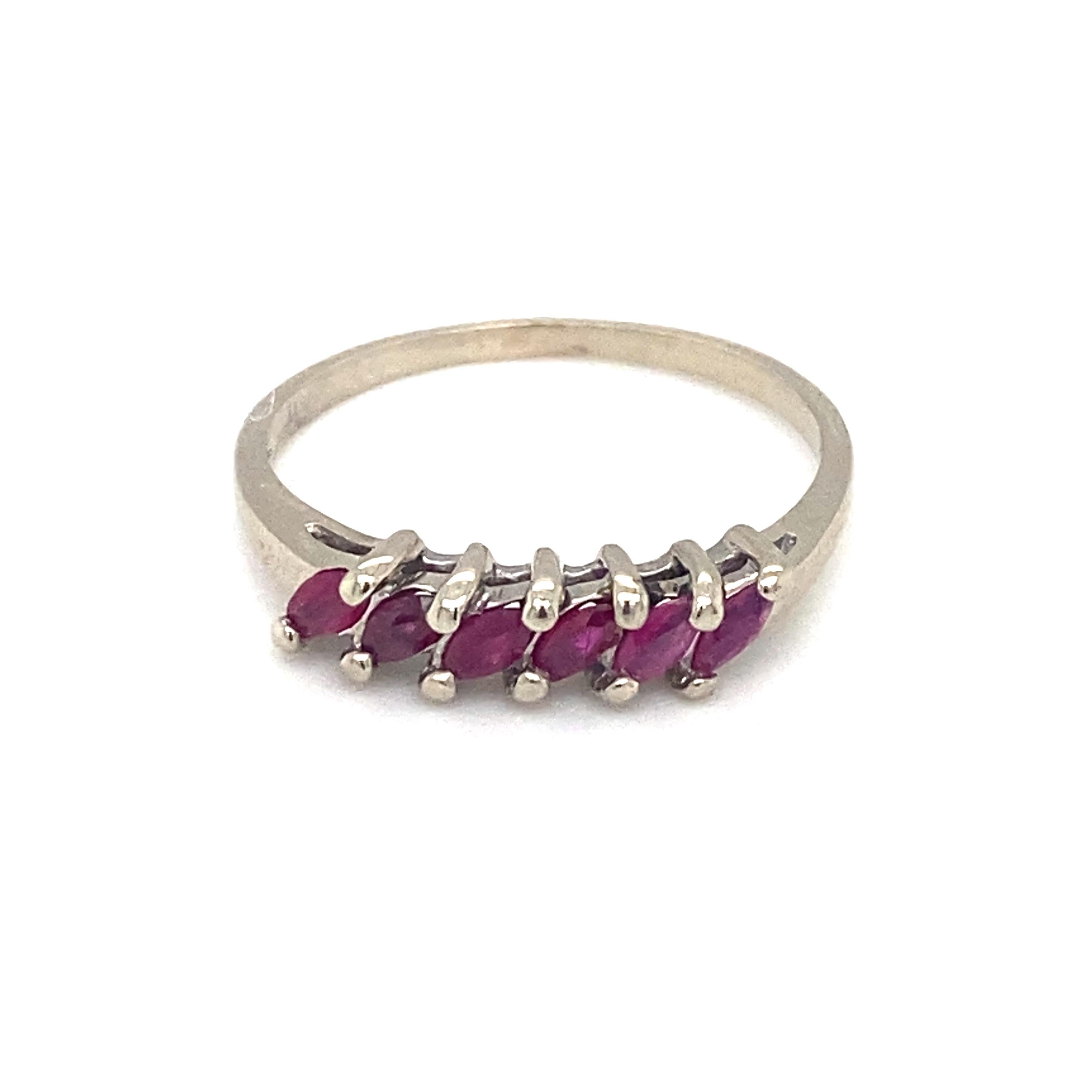 
Item Details: This unique band features marquise rubies at over a quarter of a carat. 

Circa: 1950s
Metal Type: 10k white gold
Weight: 1.8g
Size: US 8.25, resizable

Ruby Details:

Carat: 0.30 carat total weight
Shape: Marquise
Color: Pigeon blood