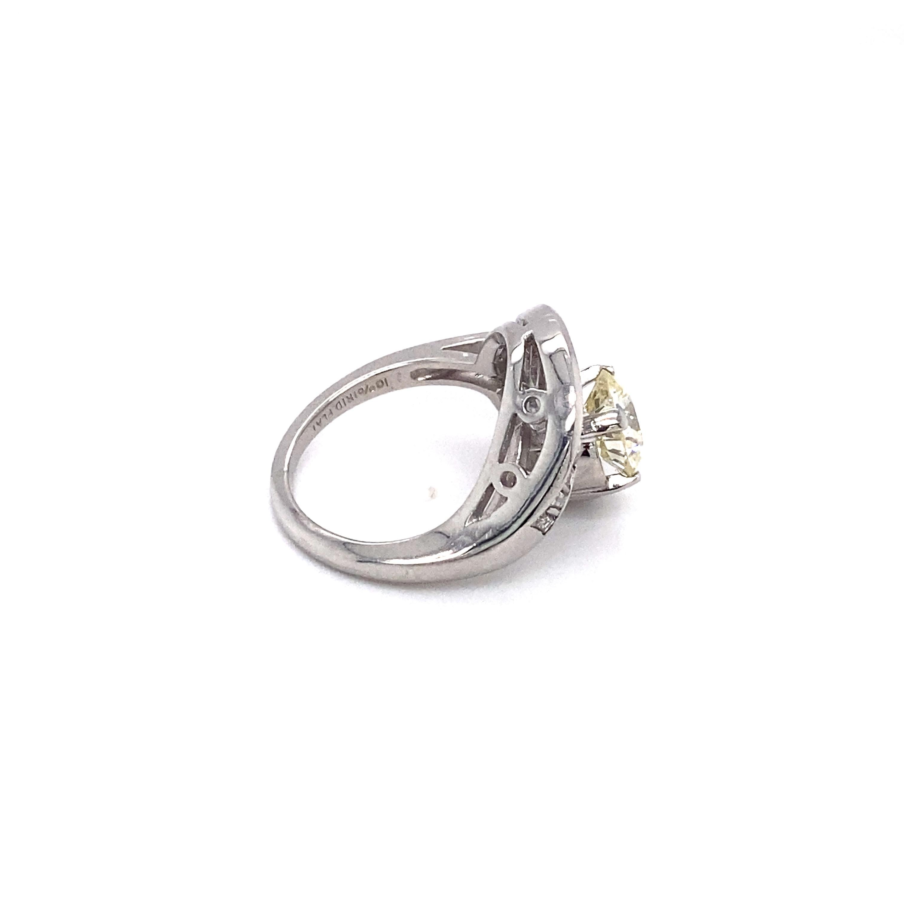 This beautiful swirl ring features a center diamond at 1.37 carats. The ring dates from the 1950s, but the center diamond likely dates from the early 1900s. 

Circa: 1950s
Metal Type: Platinum
Weight: 9 grams
Size: US 4.25, resizable

Diamond