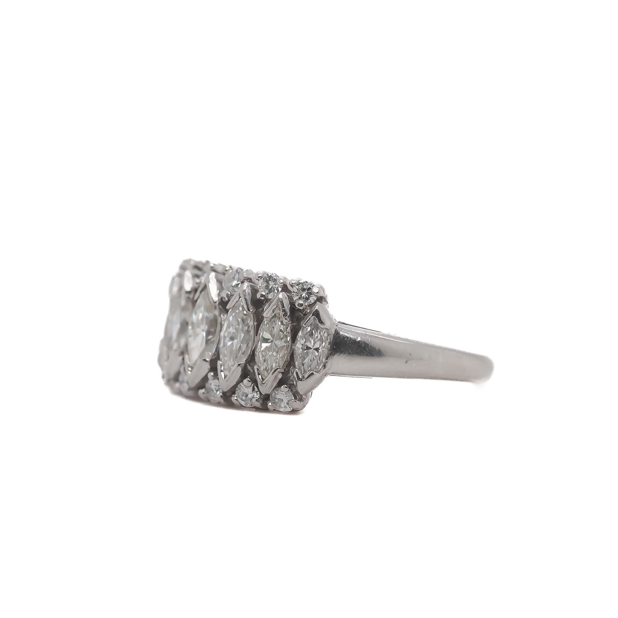 Year: 1950s

Item Details:
Ring Size: 4.75 (Sizeable)
Metal Type: Platinum [Hallmarked, and Tested]
Weight: 7.2 grams

Diamond Details: 1.00ct total weight, Antique Marquise and Transitional Rounds.

Finger to Top of Stone Measurement:
