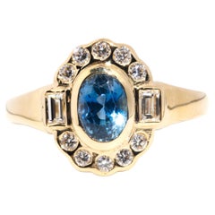 Circa 1950s Ceylon Sapphire and Diamond Vintage 18 Carat Gold Halo Cluster Ring