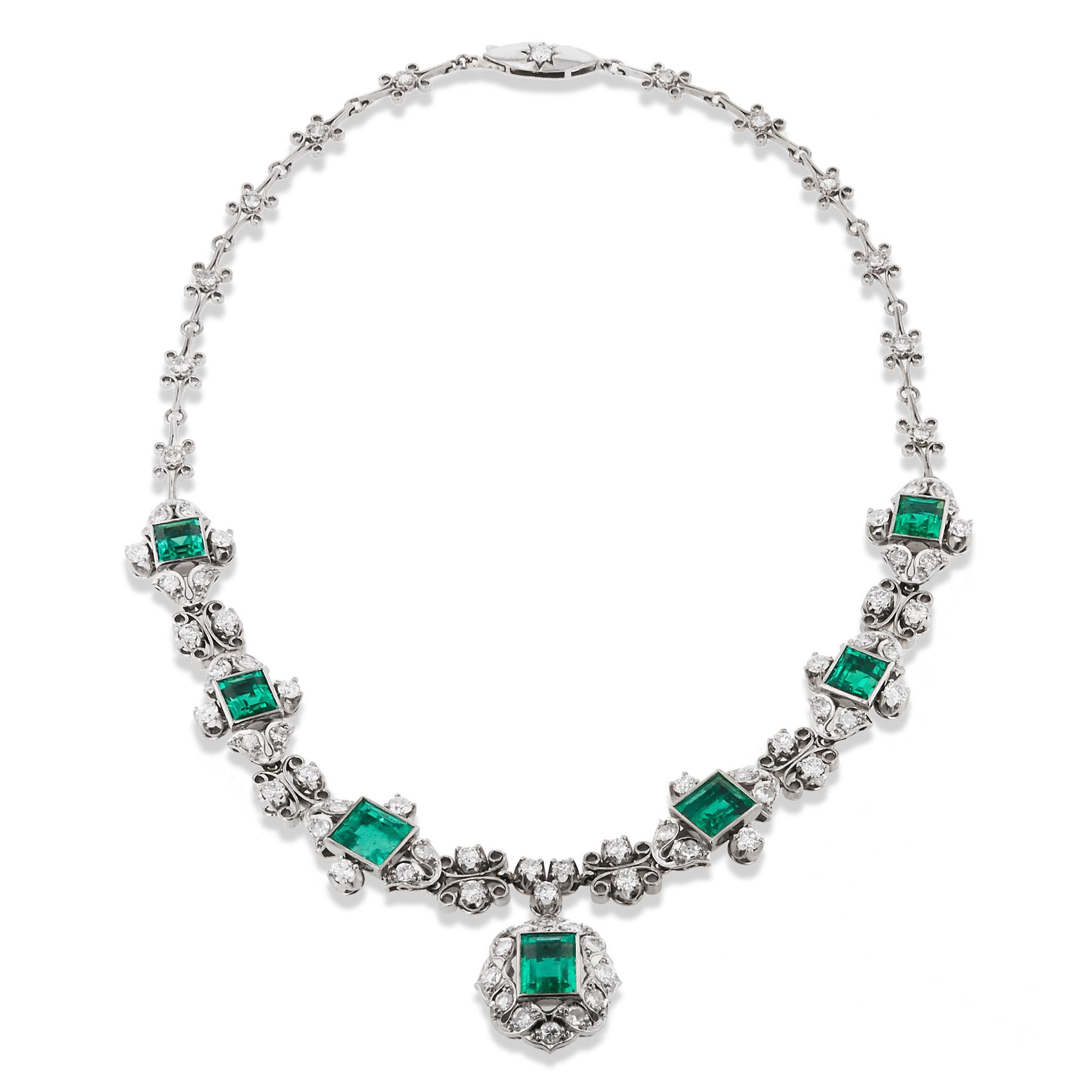 This Rare Circa 1950's necklace is a true classic, crafted from 18 karat gold and 15 karat palladium. 

Adorned with 15 total carats of natural, no oil, Emeralds and 5.50 Carats of European cut and single cut diamonds.

The GIA Certificates prove