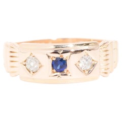 Circa 1950s Old Cut Diamond and Sapphire Three Stone Ring in 14 Carat Rose Gold