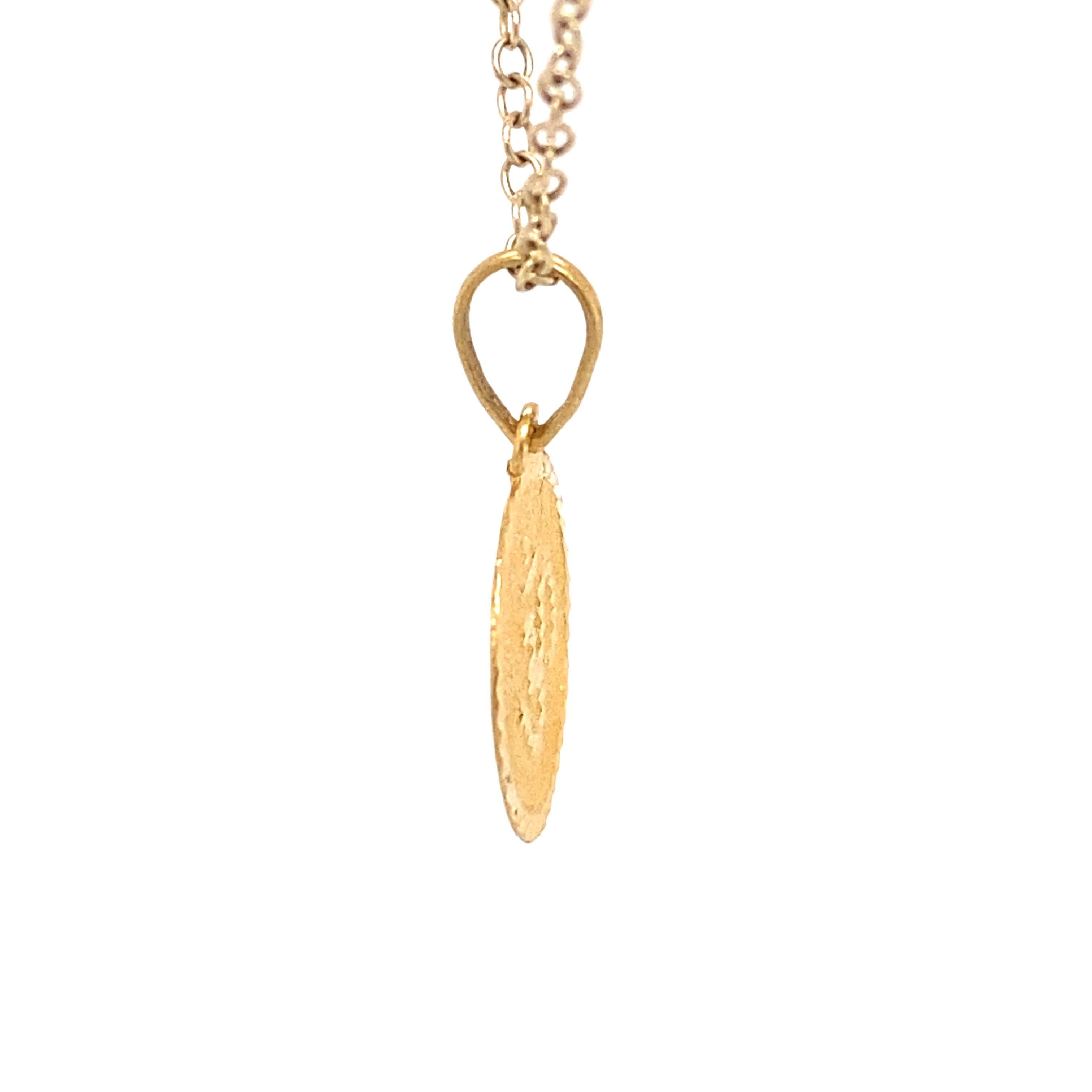Circa: 1950
Metal Type: 22 karat yellow gold 
Weight: 1.1 grams
Dimensions: 0.8in H including bail x 0.5in Width

Chain not included. 