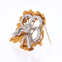 Platinum and 18 Karat Yellow Gold 4 Carat Diamond Bow Brooch, circa 1950s