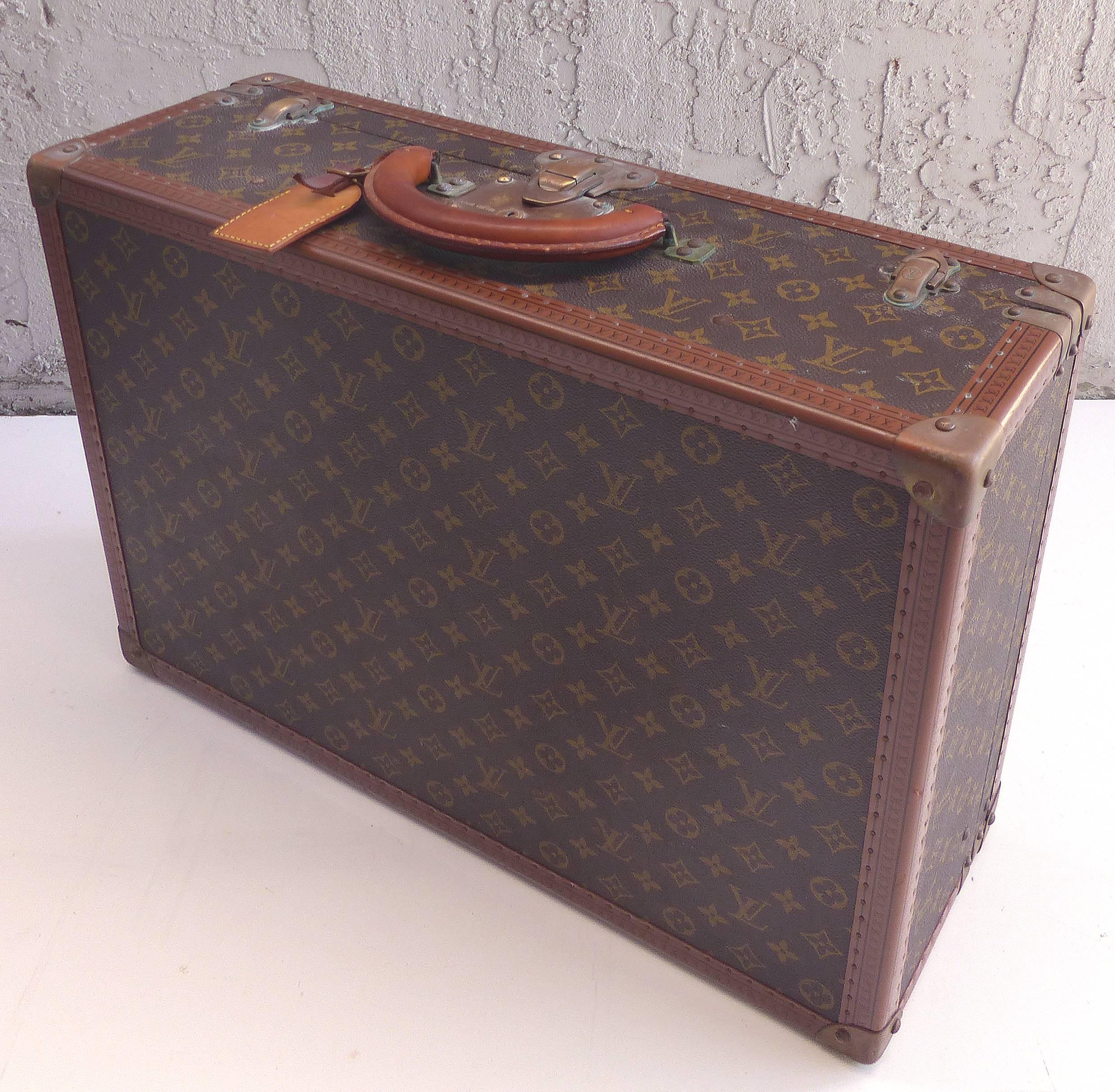 Small Louis Vuitton Hard Case Suitcase, circa 1950s

Offered for sale is a small overhead size Louis Vuitton hard case suitcase from the 1950s. The interior serial number is # 963811 and is marked Ave Marceau 78 bis, Paris. Also marked Nice - 2 Ave