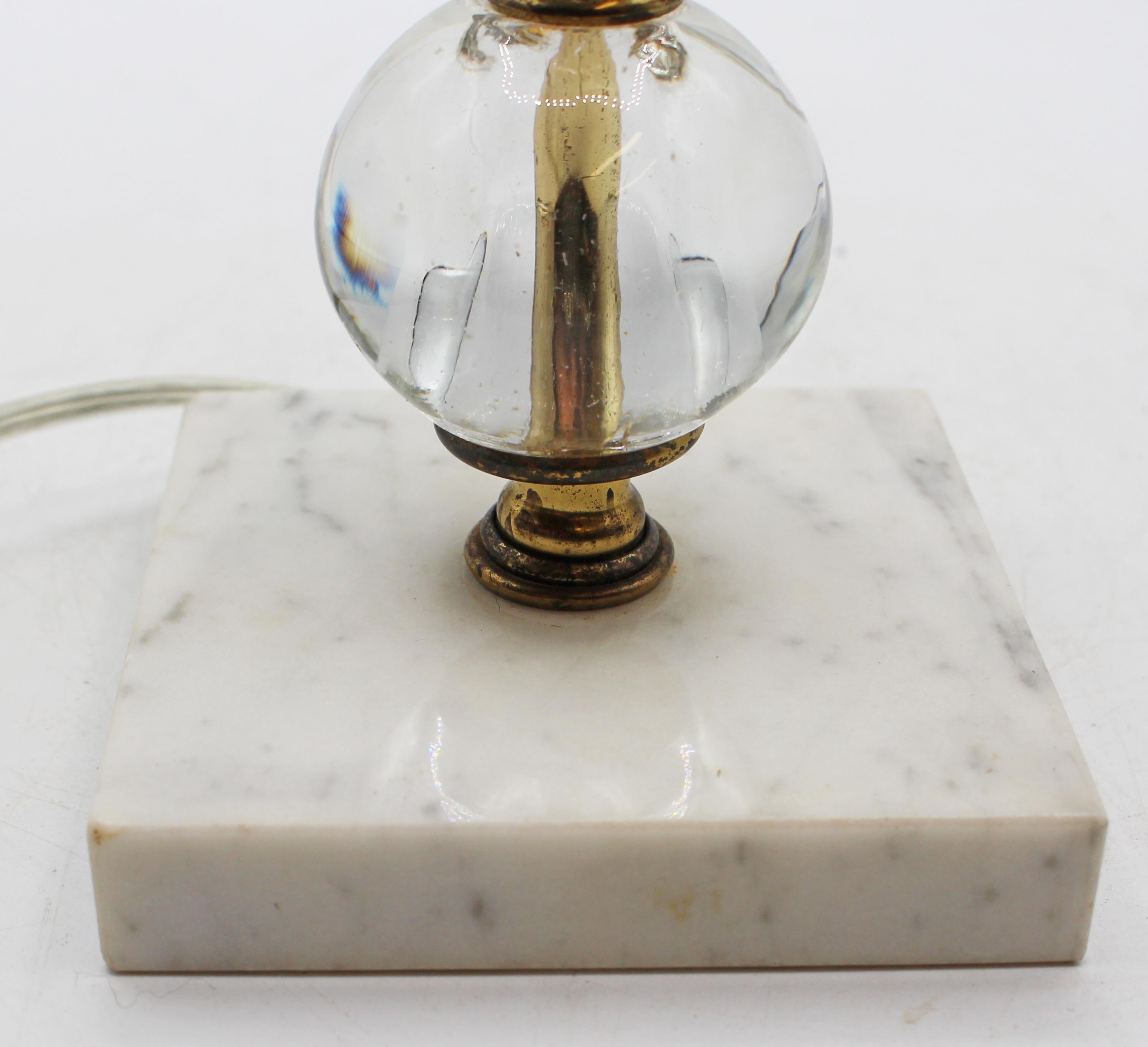 Circa 1950s stacked cut & orb crystal lamp with Carrara marble base. Rewired at some point. Wear on mellow, patinated brass finial.
4