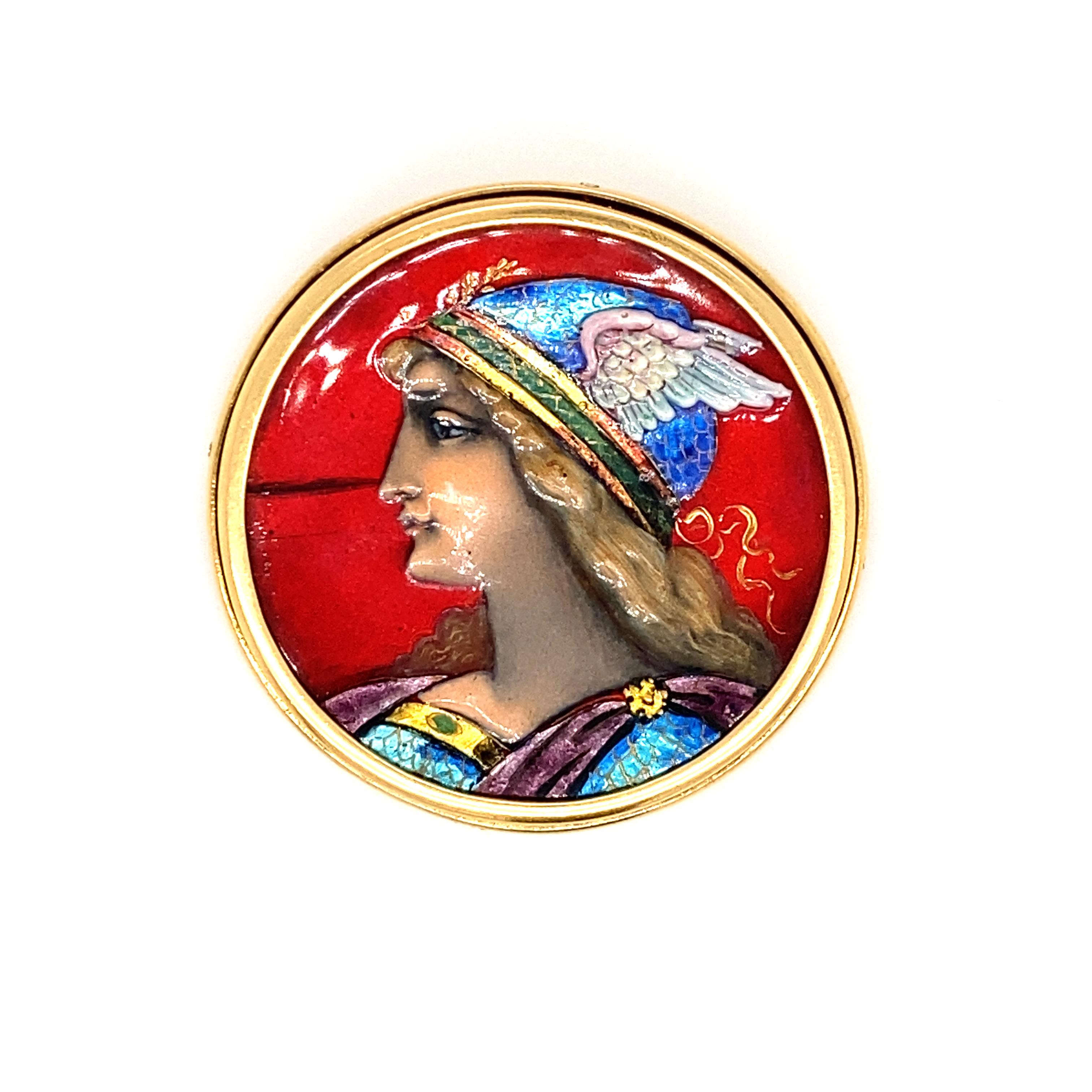 This enamel portrait brooch is handmade from Switzerland. Its brilliant enamel design depicts a mythological warrior. The frame of this enamel brooch is made in 18 karat gold and is stamped 