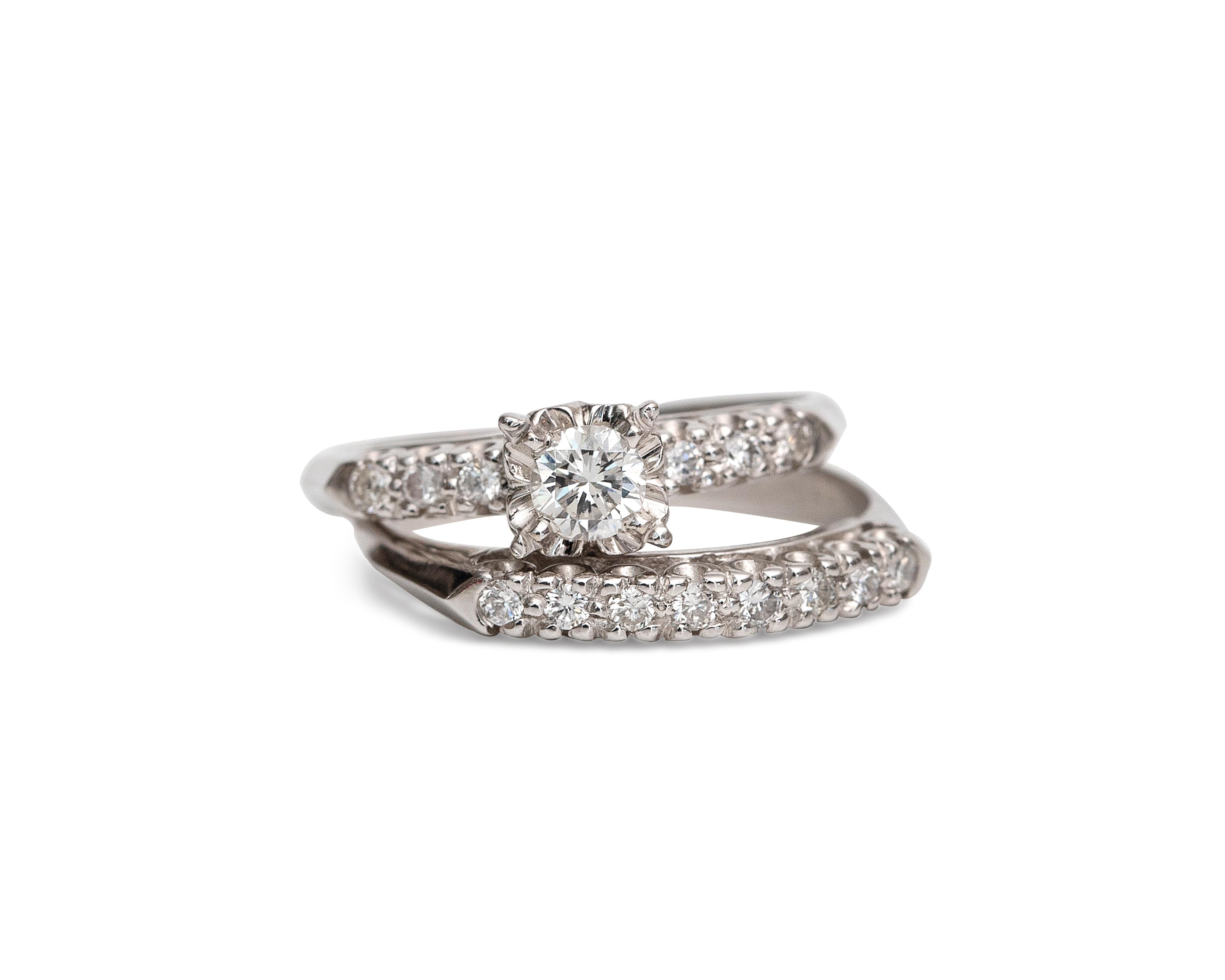 Here we have a Vintage 1950's 14K white gold engagement ring set. So many dazzling accent diamonds in this duo weighing .05 carats and a 1.01-carat center diamond that takes the stage! This piece would make a perfect bridal set for the big day or