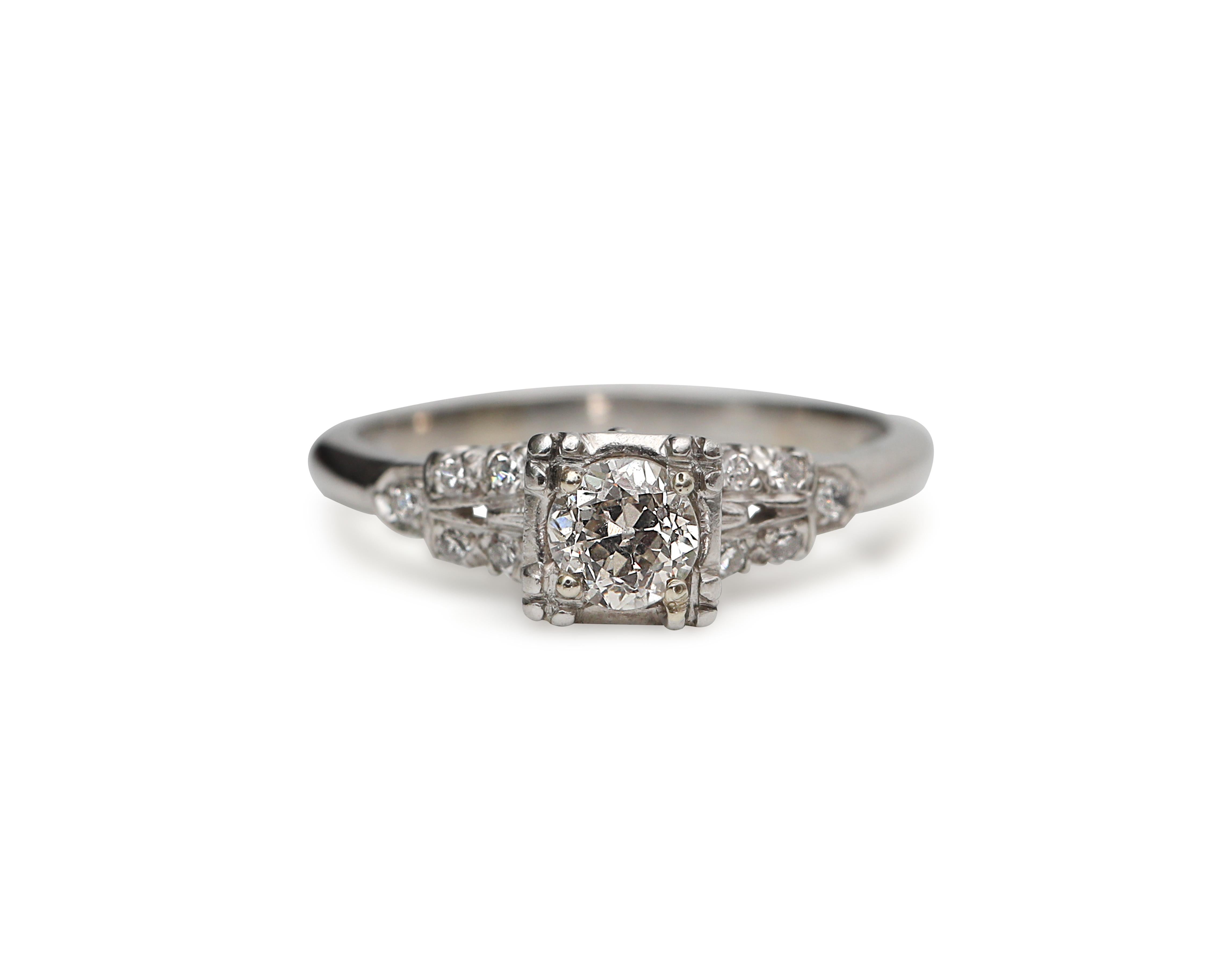 This classic diamond engagement ring features a lively .42 carat solitaire Diamond set in the center with squared head. Smaller round diamonds flank the centeron a split shank with sparkle from shoulder to shoulder! 

This is a true vintage piece,