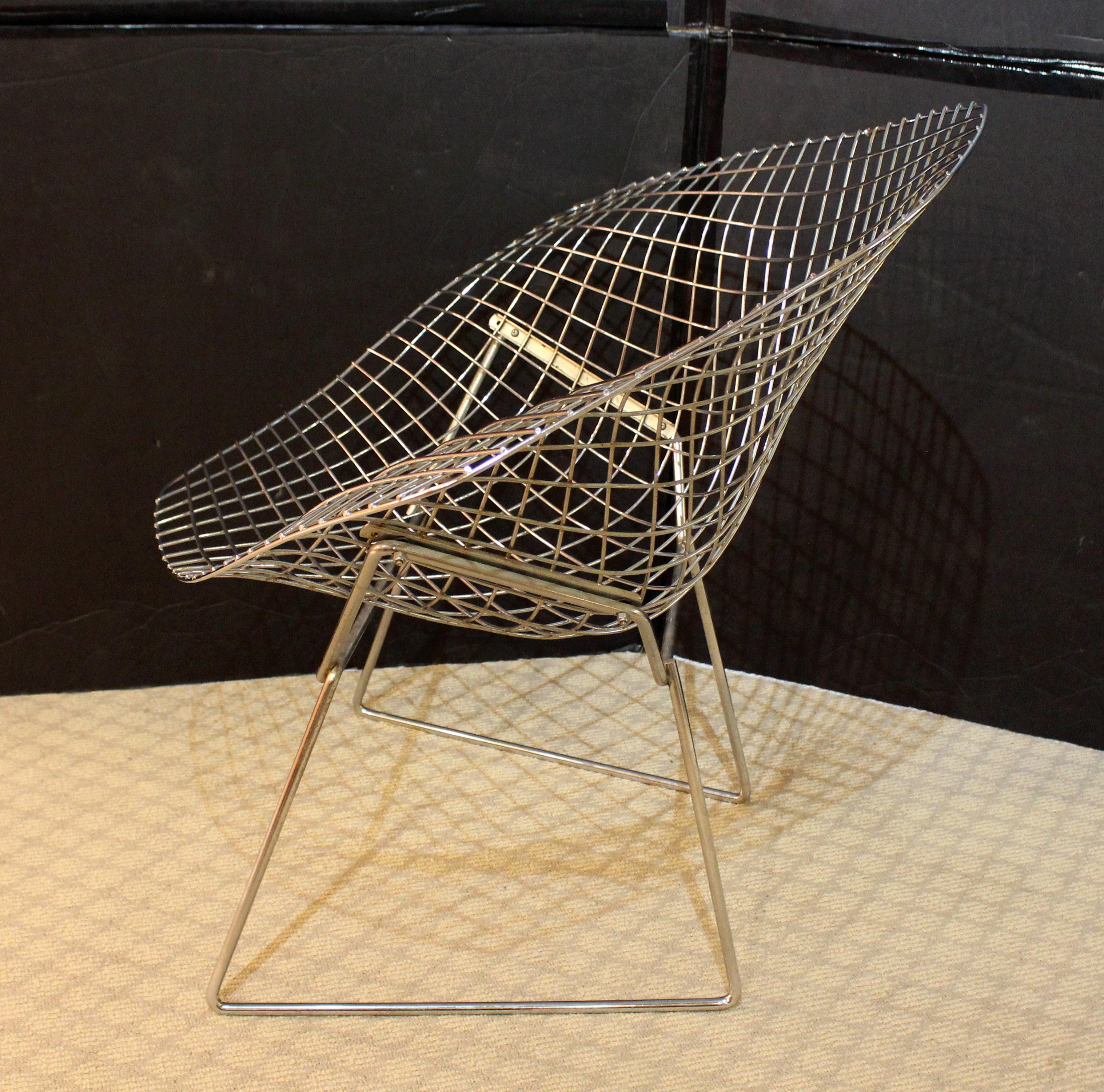 Circa 1960-70 Bertoia diamond back lounge chair by Knoll. Polished chrome. One of the great chairs of the 20th century. Wear on bottom due to glides missing (typical for the early chairs). Some discoloration in areas weathered. Overall good