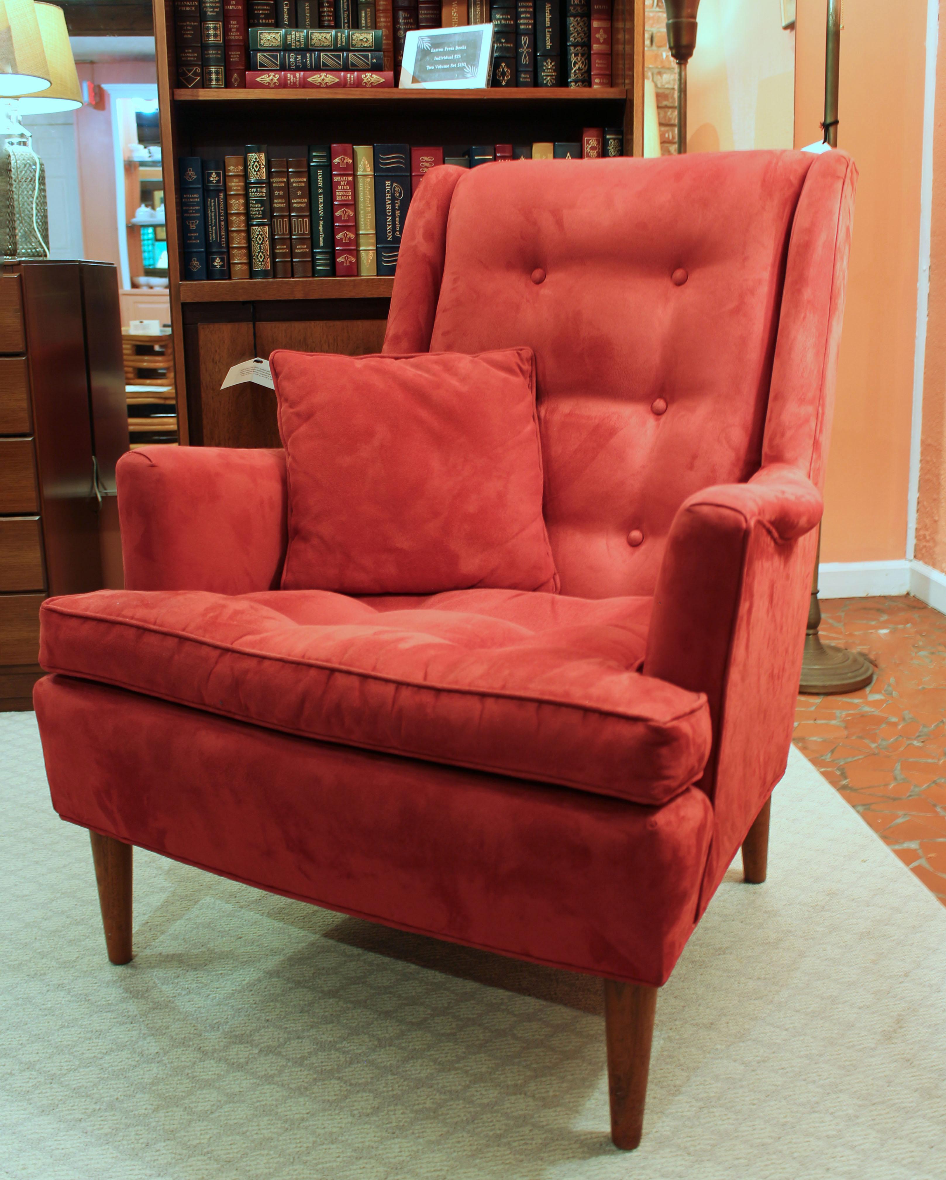 A c.1960 Henredon lounge chair. Handsome and comfortable raised on turned, tapered legs. Now in ultrasuede fabric. Acquired from Style Craft of Chapel Hill. Sculpted arms. Tufted back and seat. (Matching protective arm and head rest covers with some