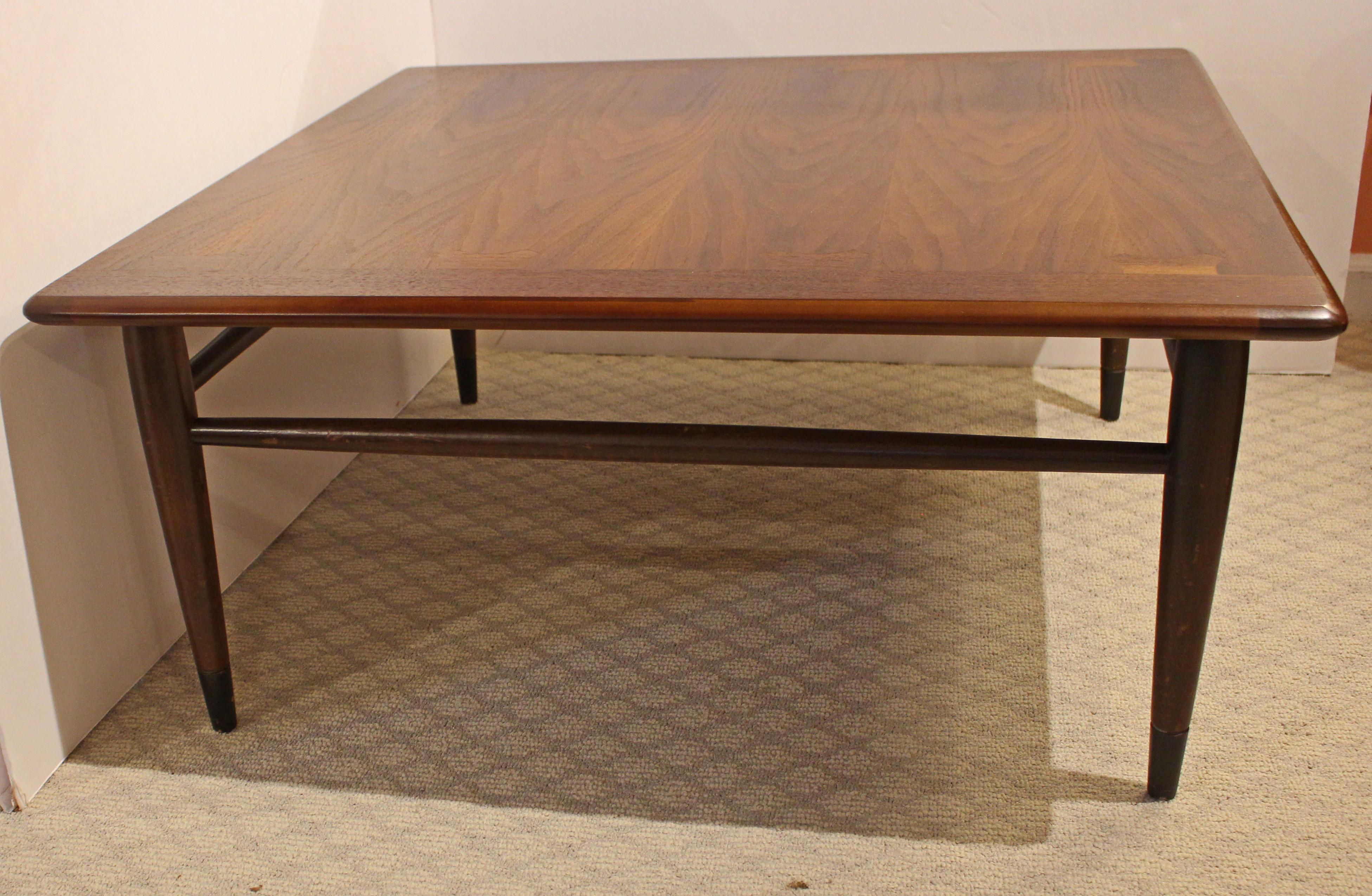 Mid century modern c.1960 square coffee or corner table. Walnut, raised on classic turned, tapered bronze metal capped legs. Stunning walnut selection on top veneers. Inlay plays on Acclaim line by Lane, possibly a small run preceding the Acclaim