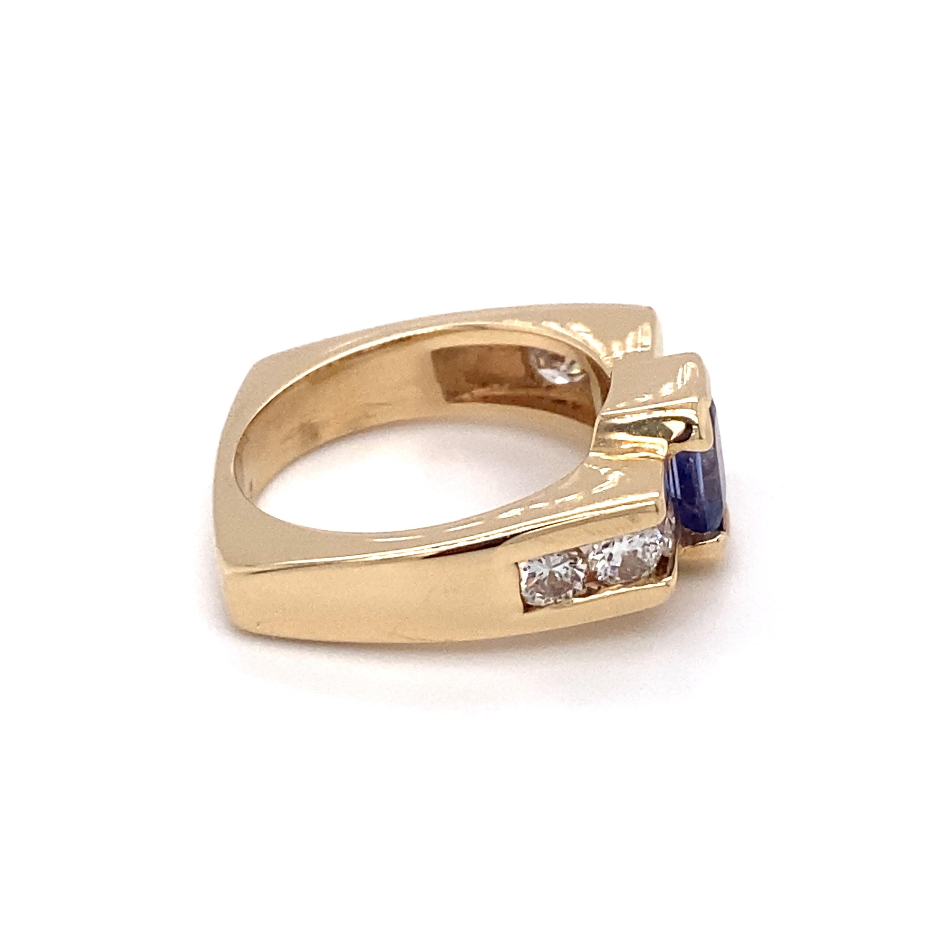 Art Deco Circa 1960s 1.0 Carat Tanzanite and Diamond Asymmetrical Ring in 14K Gold For Sale