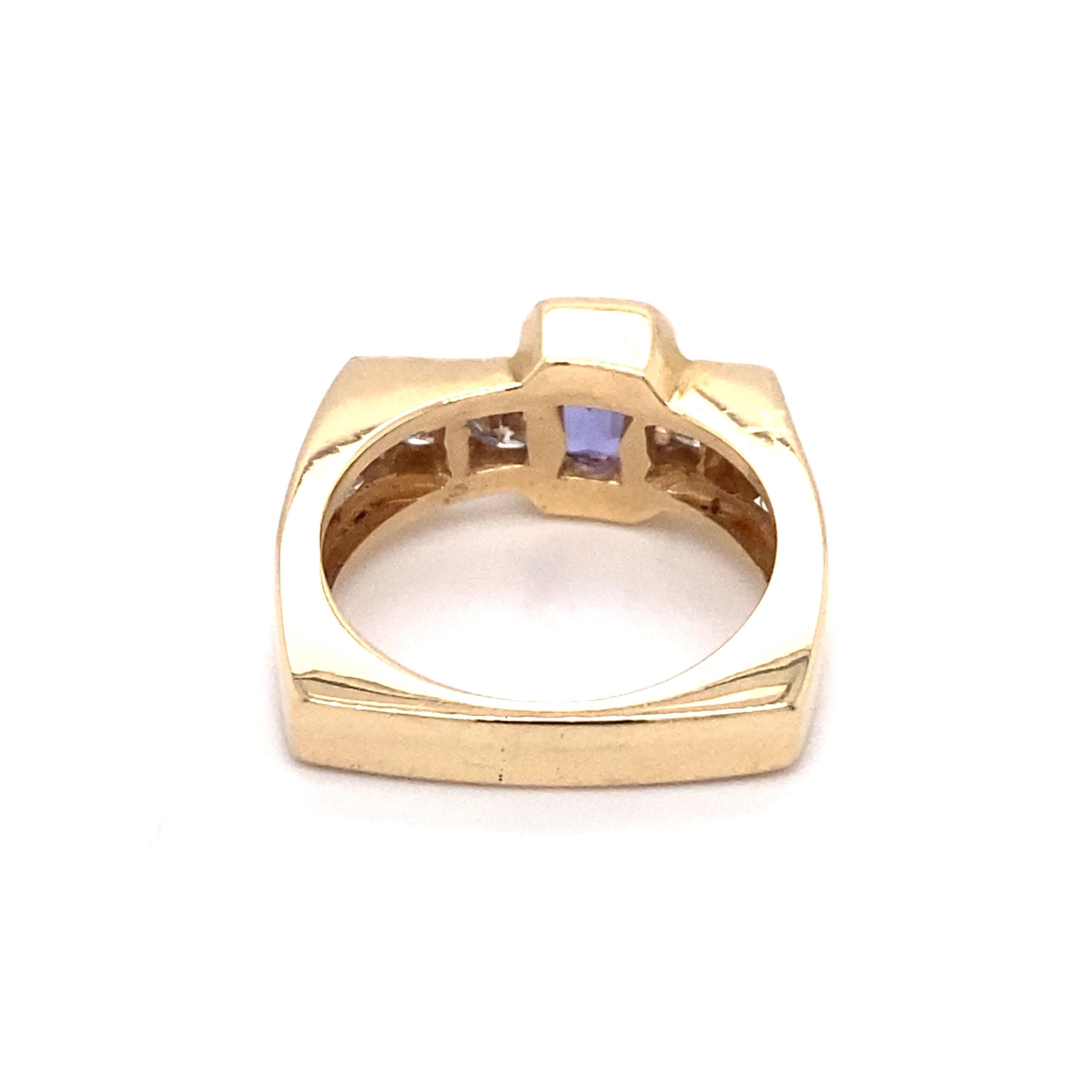 Emerald Cut Circa 1960s 1.0 Carat Tanzanite and Diamond Asymmetrical Ring in 14K Gold For Sale
