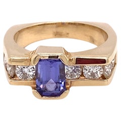 Vintage Circa 1960s 1.0 Carat Tanzanite and Diamond Asymmetrical Ring in 14K Gold