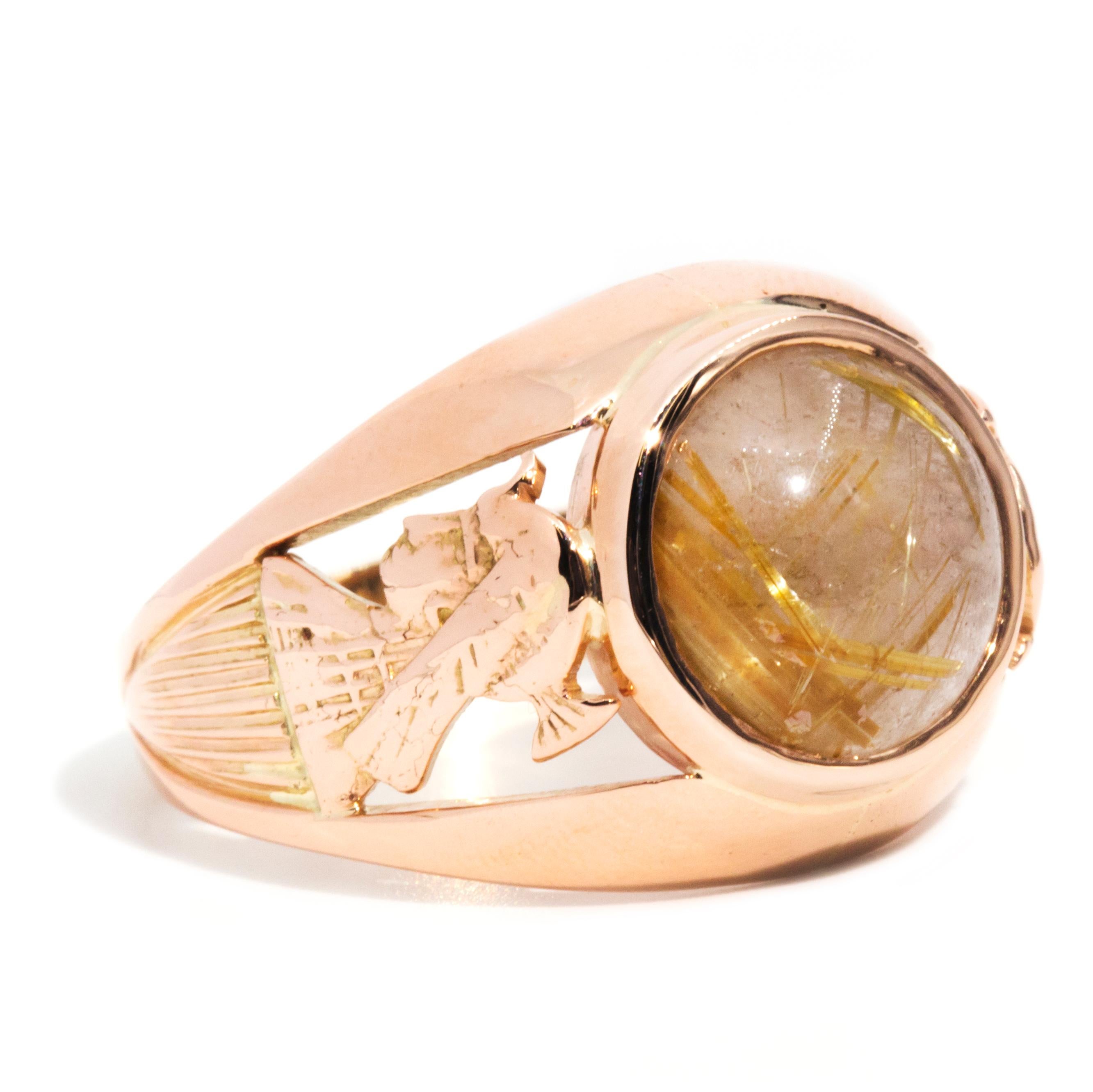 Forged in 14 carat rose gold, this one-of-a-kind vintage dome ring features intricately pierced shoulders with a side facing profile of a woman in armour. The shoulders rise into an opulent bezel housing a cabochon cut rutilated quartz gem. This