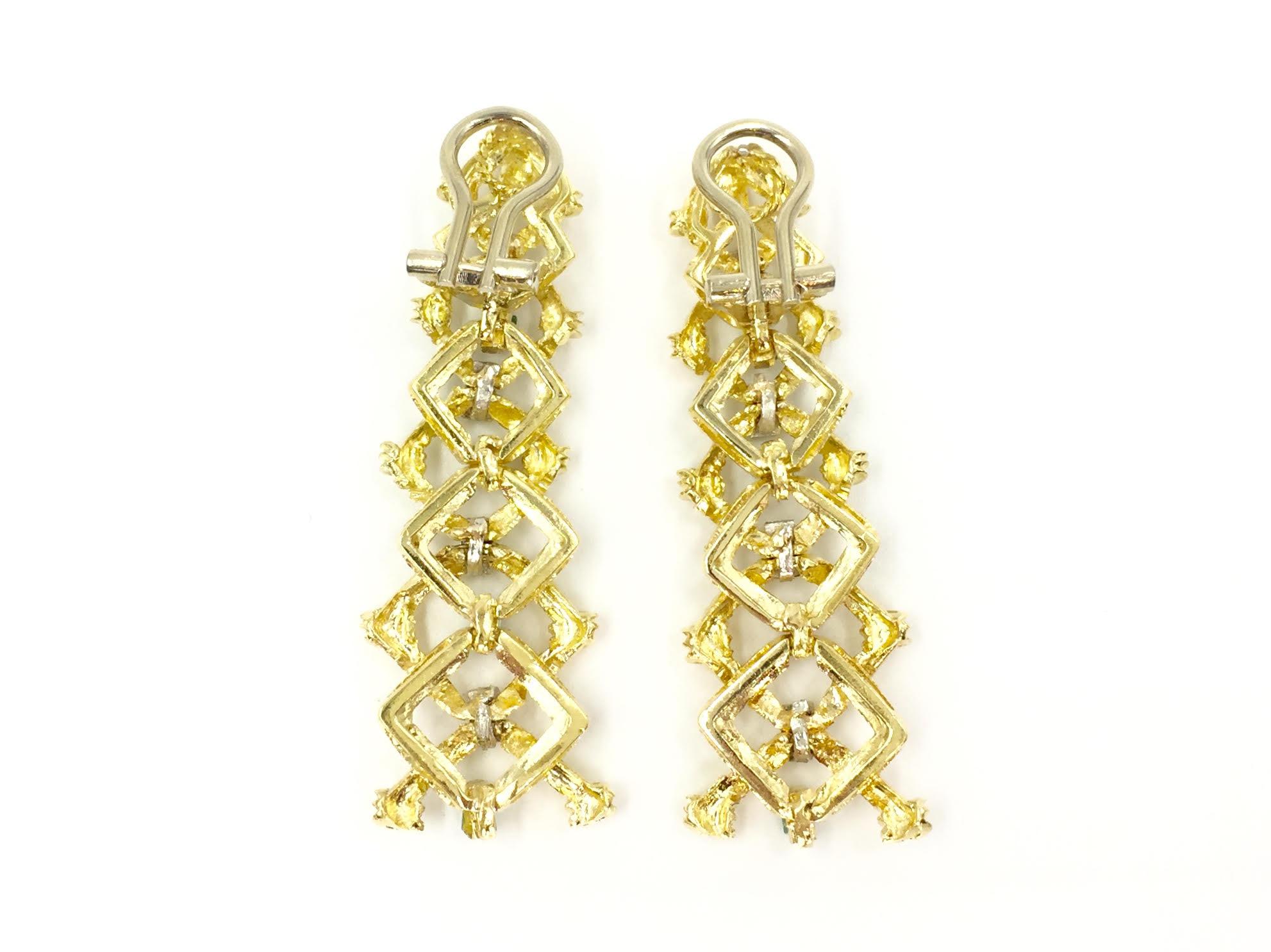 Unique mid-century 18 karat yellow gold geometric link design drop earrings featuring baguette diamonds and emeralds. Earrings have approximately .50 carat of emeralds and .30 carats of baguette diamonds. Drop of earrings have movement so they do