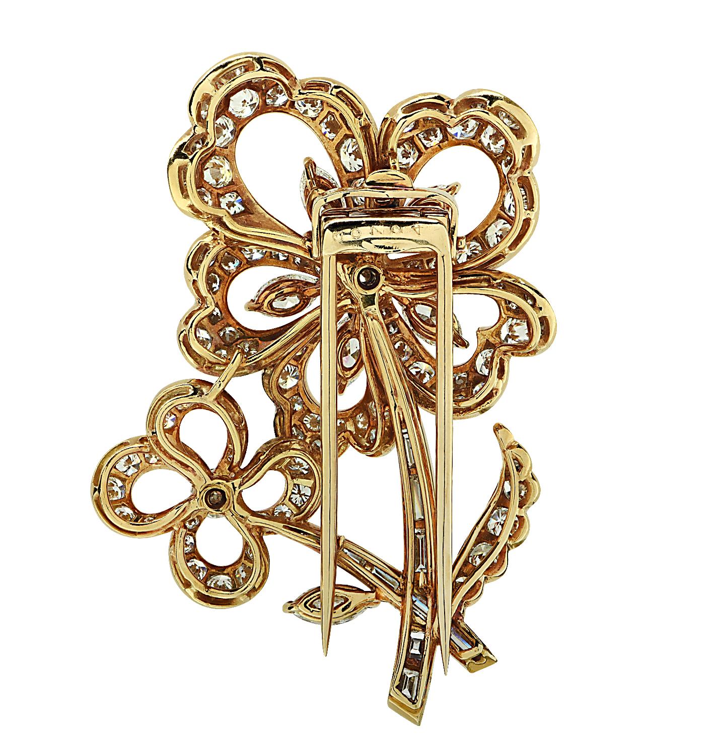 From the esteemed House of Cartier emerges a magnificent brooch, artfully sculpted from 18-karat yellow gold. This exquisite piece boasts a medley of 118 marquise, round brilliant, and baguette-cut diamonds weighing 7.68 carats, F color, VS clarity,