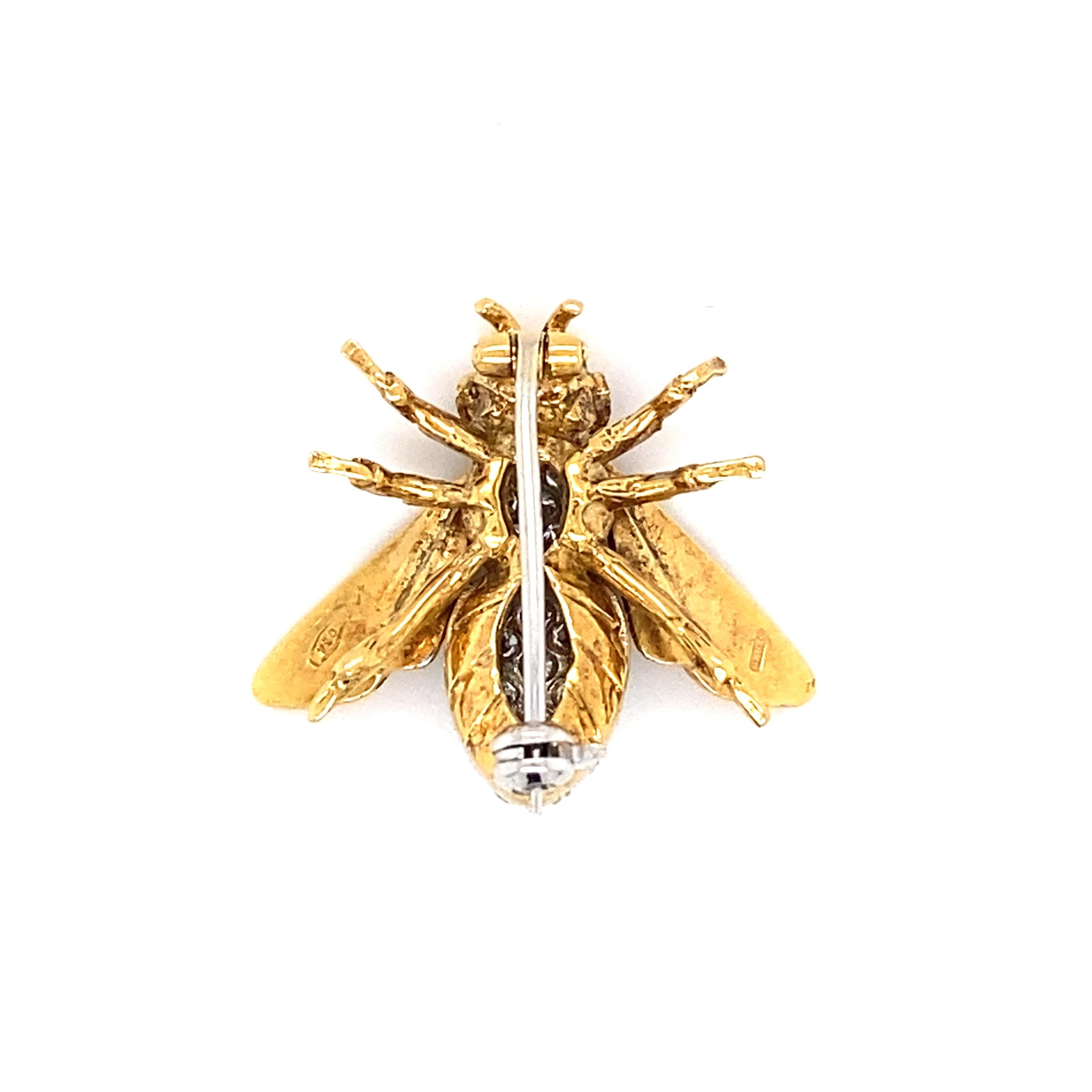 Item Details: This vintage bee brooch has diamond pave accents and ruby eyes.

Circa: 1960s
Metal Type: 18 Karat Yellow Gold

Diamond Details:

Carat: 0.40 carat total weight
Shape: Round
Color: G-H
Clarity: VS