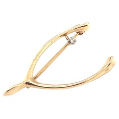 Vintage Circa 1960s Diamond Wishbone Lucky Charm Brooch in 14 Karat Gold