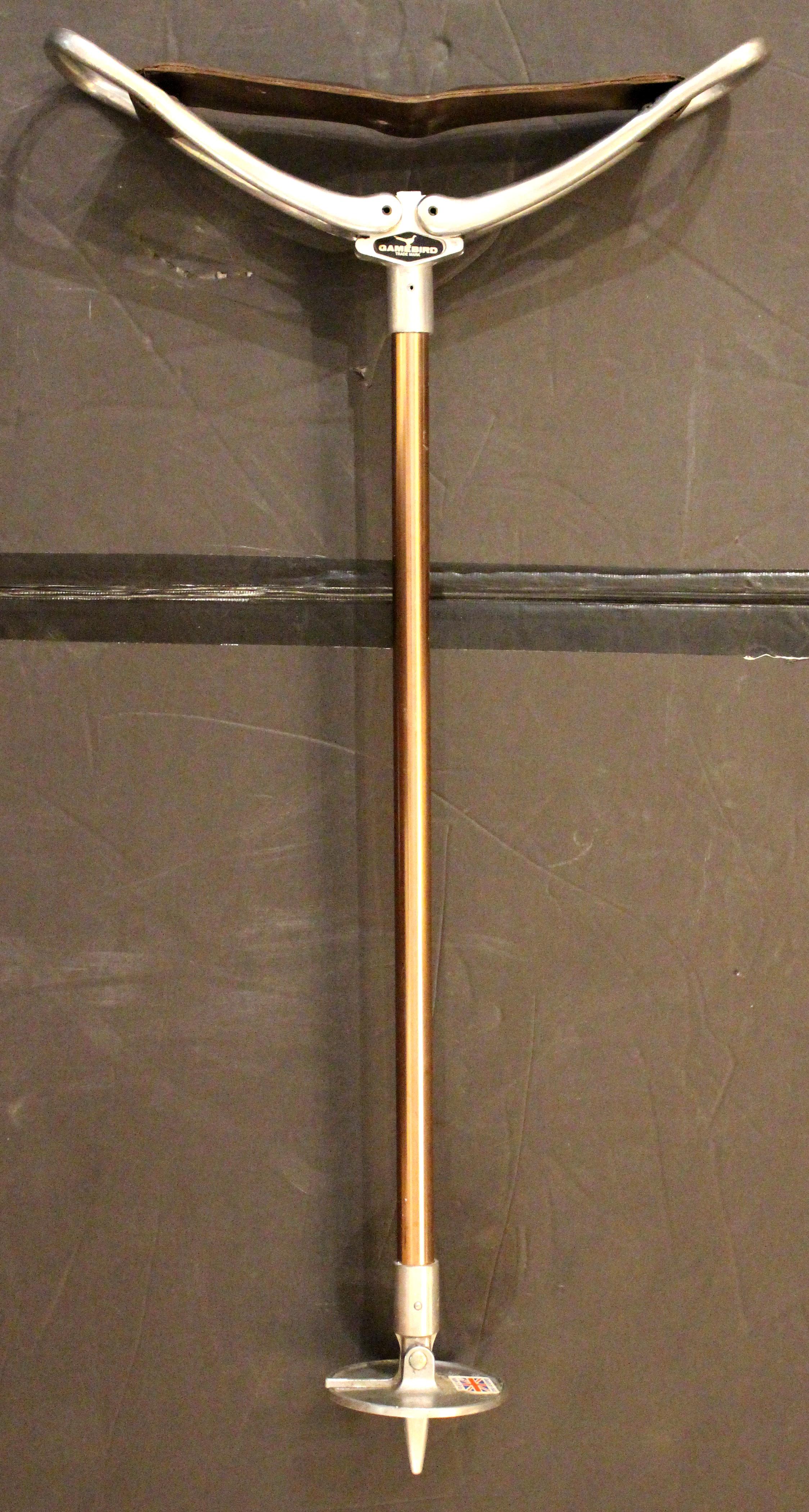Circa 1960s English sporting event or hunting walking stick with folding seat. Steel with coppered finish shaft, leather seat. 